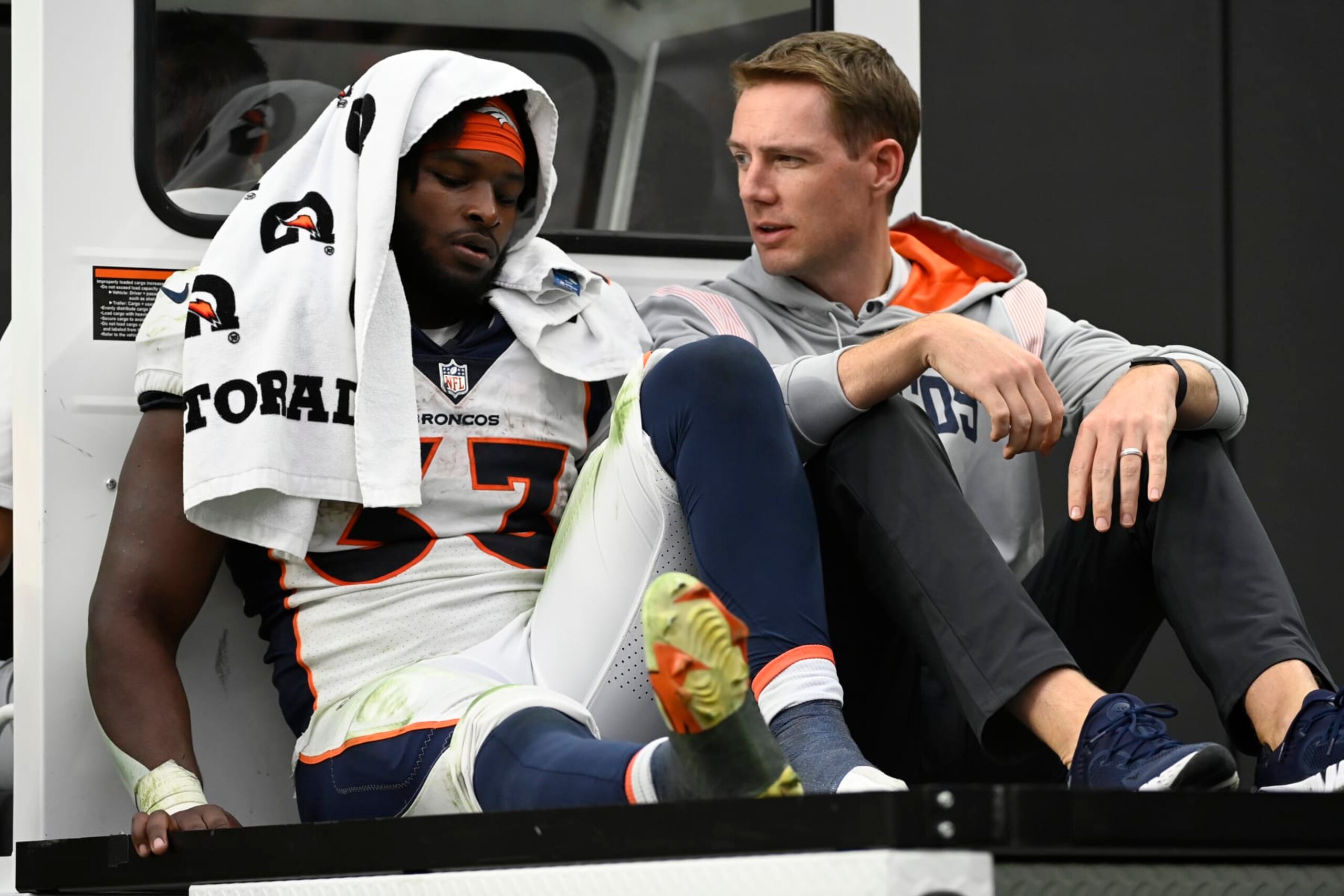 Denver Broncos running back Javonte Williams (33) is cartted off the field during the second half of an NFL football game against theLas Vegas Raiders, Sunday, Oct. 2, 2022, in Las Vegas. (AP Photo/David Becker)