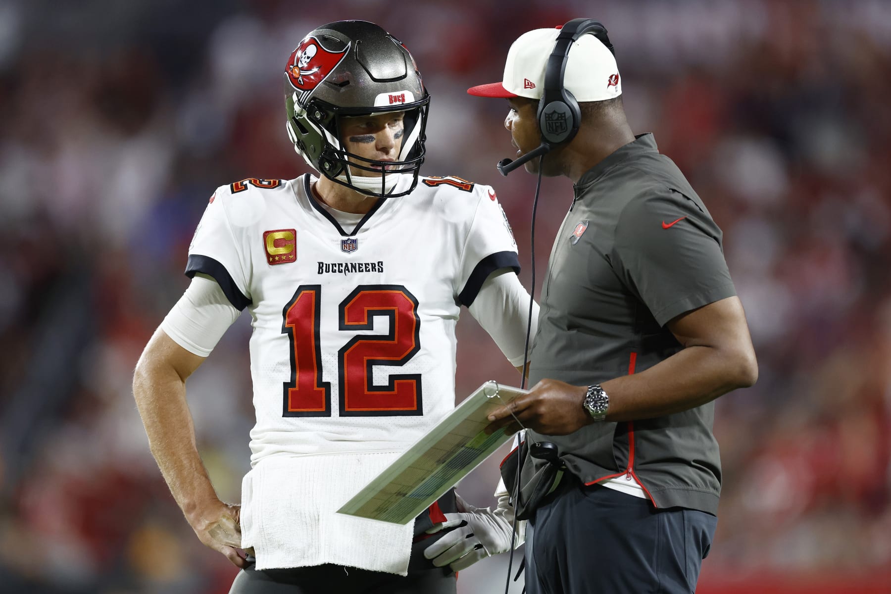 TAMPA, FLORIDA - OCTOBER 02: Tom Brady #12 of the Tampa Bay Buccaneers talks with offensive coordinator Byron Leftwich against the Kansas City Chiefs during the third quarter at Raymond James Stadium on October 02, 2022 in Tampa, Florida. (Photo by Douglas P. DeFelice/Getty Images)
