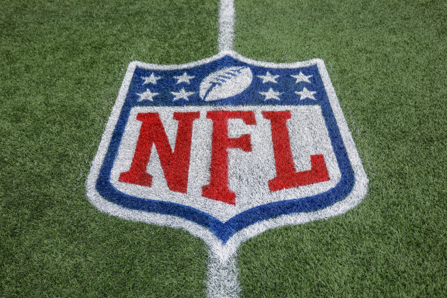 NFL logo on the field at Bank of America Stadium before an NFL game between the Carolina Panthers and the Arizona Cardinals in Charlotte, N.C., Sunday, Oct. 2, 2022. (AP Photo/Nell Redmond)