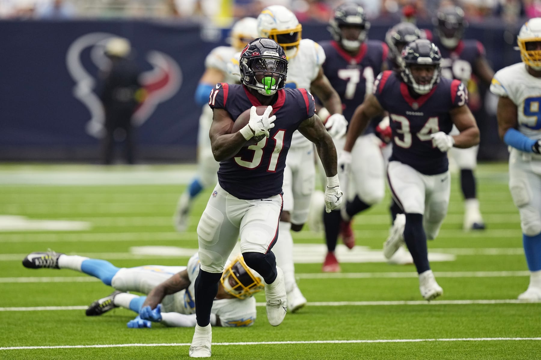 Houston Texans running back Dameon Pierce (31) runs against the Los Angeles Chargers during the first half of an NFL football game Sunday, Oct. 2, 2022, in Houston. (AP Photo/David J. Phillip)