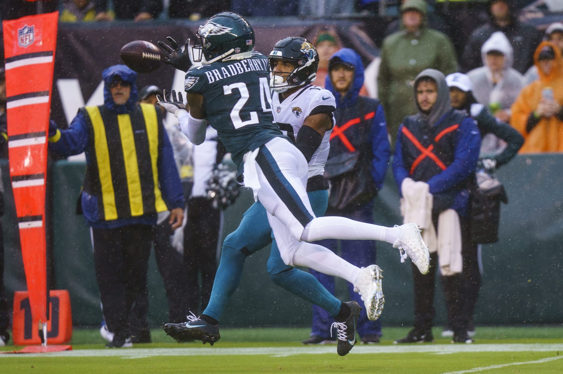 Philadelphia Eagles cornerback James Bradberry (24) intercepts the ball for Jacksonville Jaguars wide receiver Christian Kirk (13) during the NFL football game, Sunday, Oct. 2, 2022, in Philadelphia. (AP Photo/Chris Szagola)