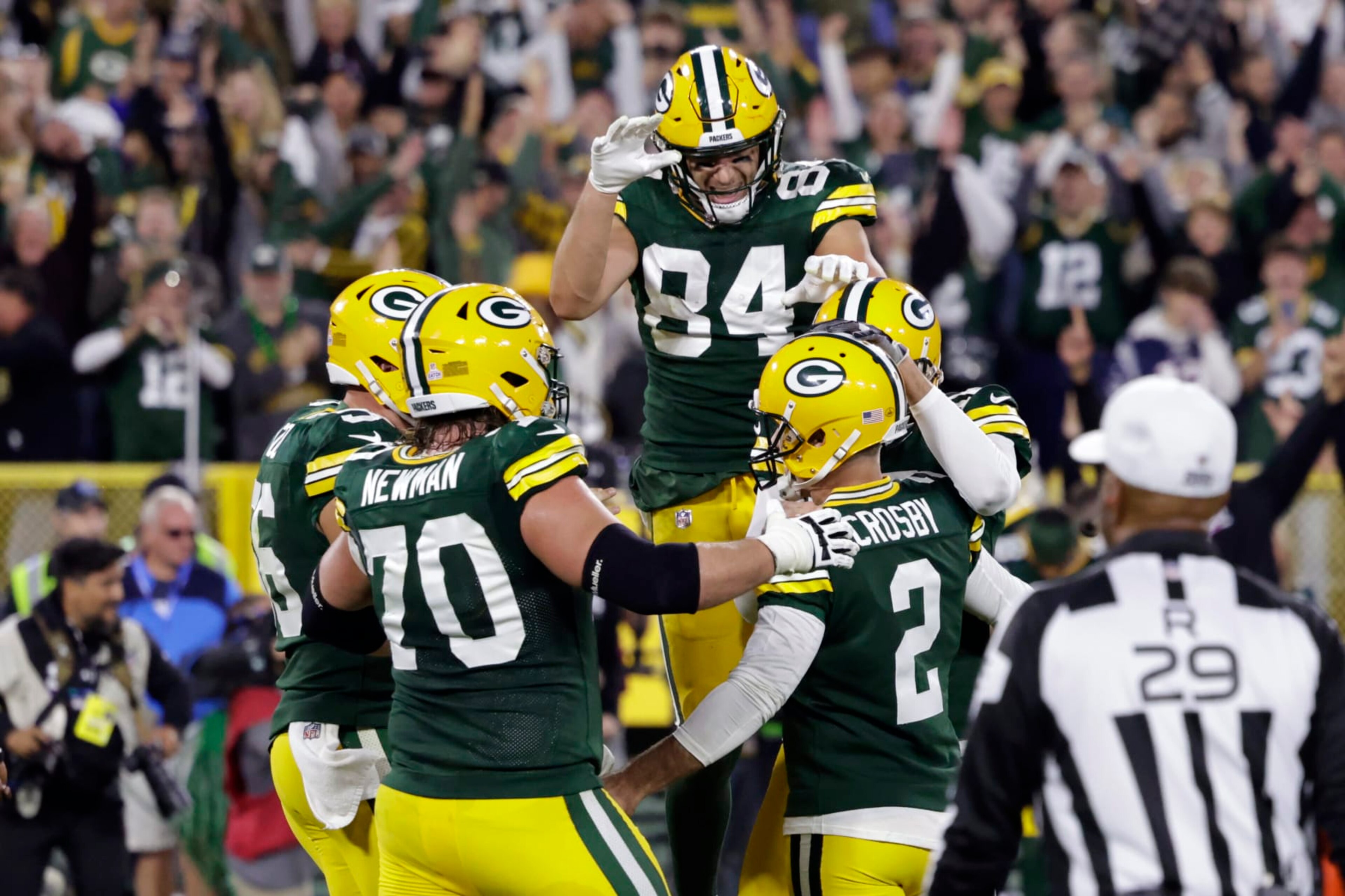 Green Bay Packers place kicker Mason Crosby (2) celebrates with teammates after kicking a 31-yard field goal during overtime in an NFL football game against the New England Patriots, Sunday, Oct. 2, 2022, in Green Bay, Wis. The Packers won 27-24. (AP Photo/Matt Ludtke) Green Bay Packers place kicker Mason Crosby (2) celebrates with teammates after kicking a 31-yard field goal during overtime in an NFL football game against the New England Patriots, Sunday, Oct. 2, 2022, in Green Bay, Wis. The Packers won 27-24. (AP Photo/Matt Ludtke)