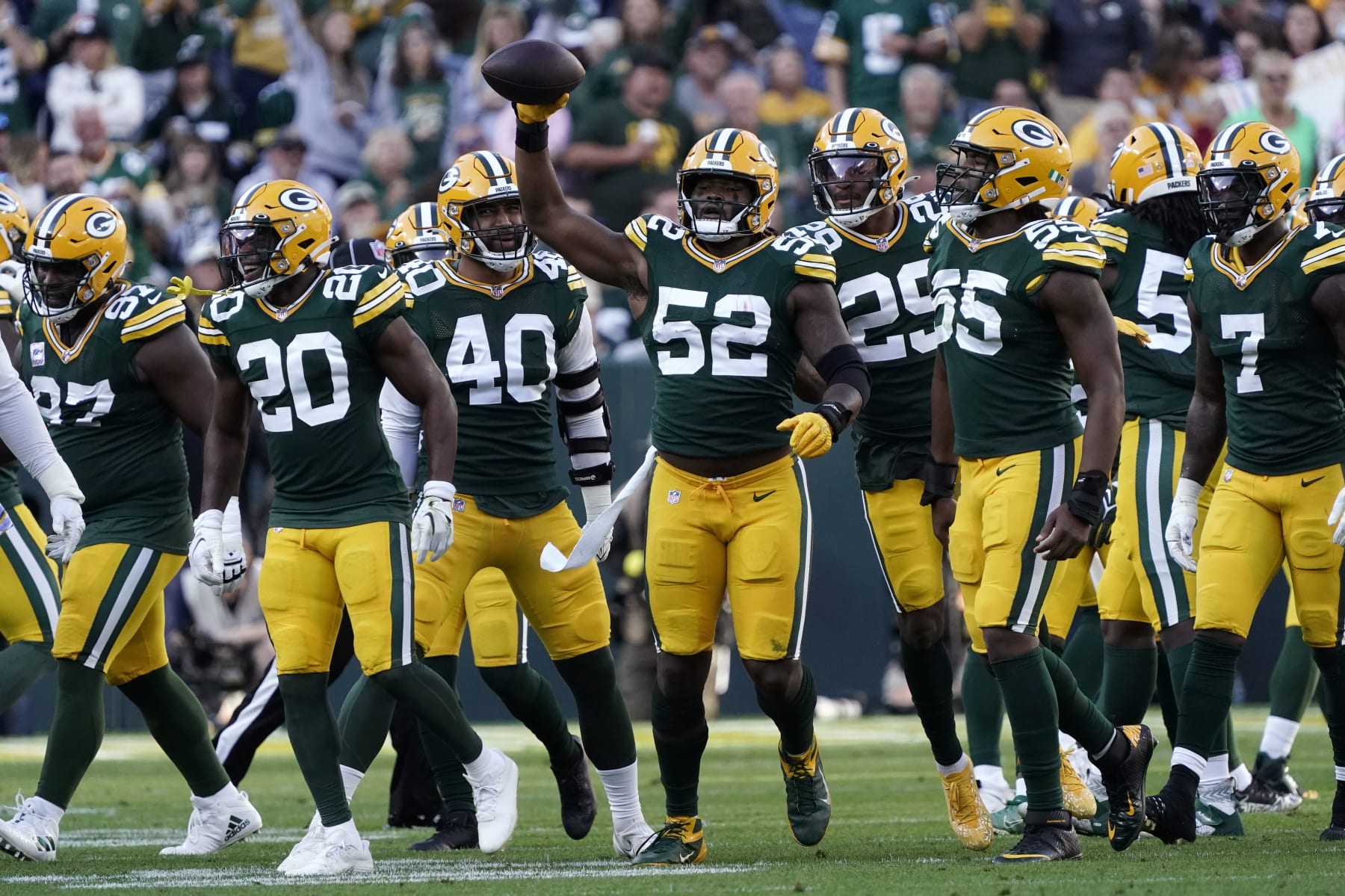 Green Bay Packers linebacker Rashan Gary (52) celebrates after recovering a fumble by New England Patriots quarterback Bailey Zappe during the first half of an NFL football game, Sunday, Oct. 2, 2022, in Green Bay, Wis. (AP Photo/Morry Gash)