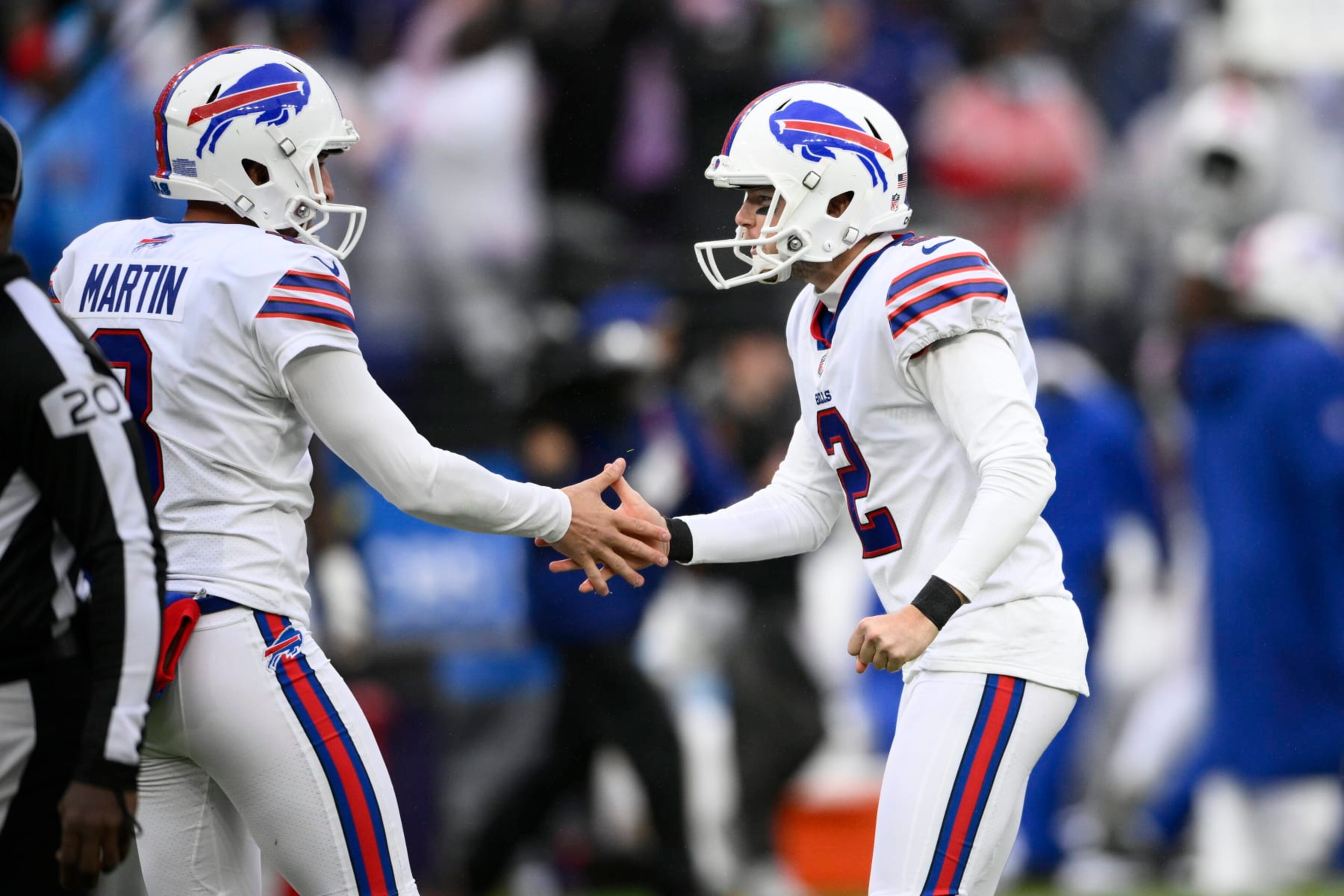 Buffalo Bills place kicker Tyler Bass (2) is congratulated by holder Sam Martin (8) after Bass kicked a field goal on the final play of the game to give the Bills a 23-20 win over the Baltimore Ravens in an NFL football game Sunday, Oct. 2, 2022, in Baltimore. (AP Photo/Nick Wass) Buffalo Bills place kicker Tyler Bass (2) is congratulated by holder Sam Martin (8) after Bass kicked a field goal on the final play of the game to give the Bills a 23-20 win over the Baltimore Ravens in an NFL football game Sunday, Oct. 2, 2022, in Baltimore. (AP Photo/Nick Wass)