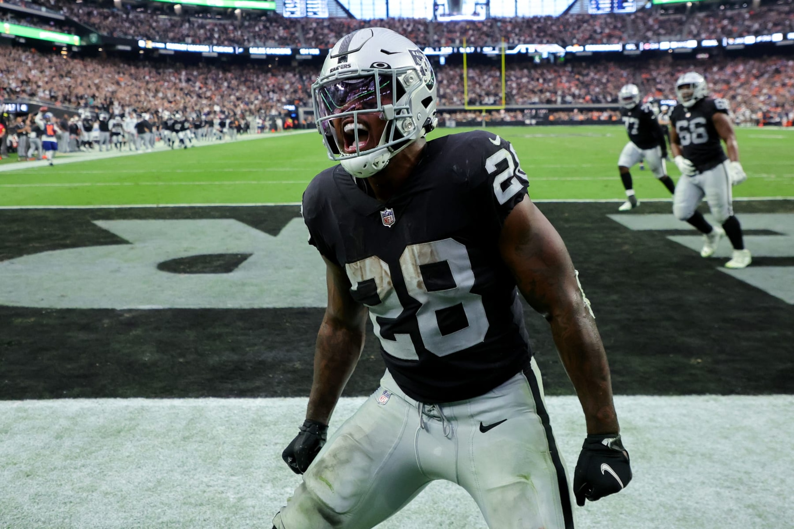 LAS VEGAS, NEVADA - OCTOBER 02: Josh Jacobs #28 of the Las Vegas Raiders celebrates after scoring a touchdown in the fourth quarter against the Denver Broncos at Allegiant Stadium on October 02, 2022 in Las Vegas, Nevada. (Photo by Ethan Miller/Getty Images)