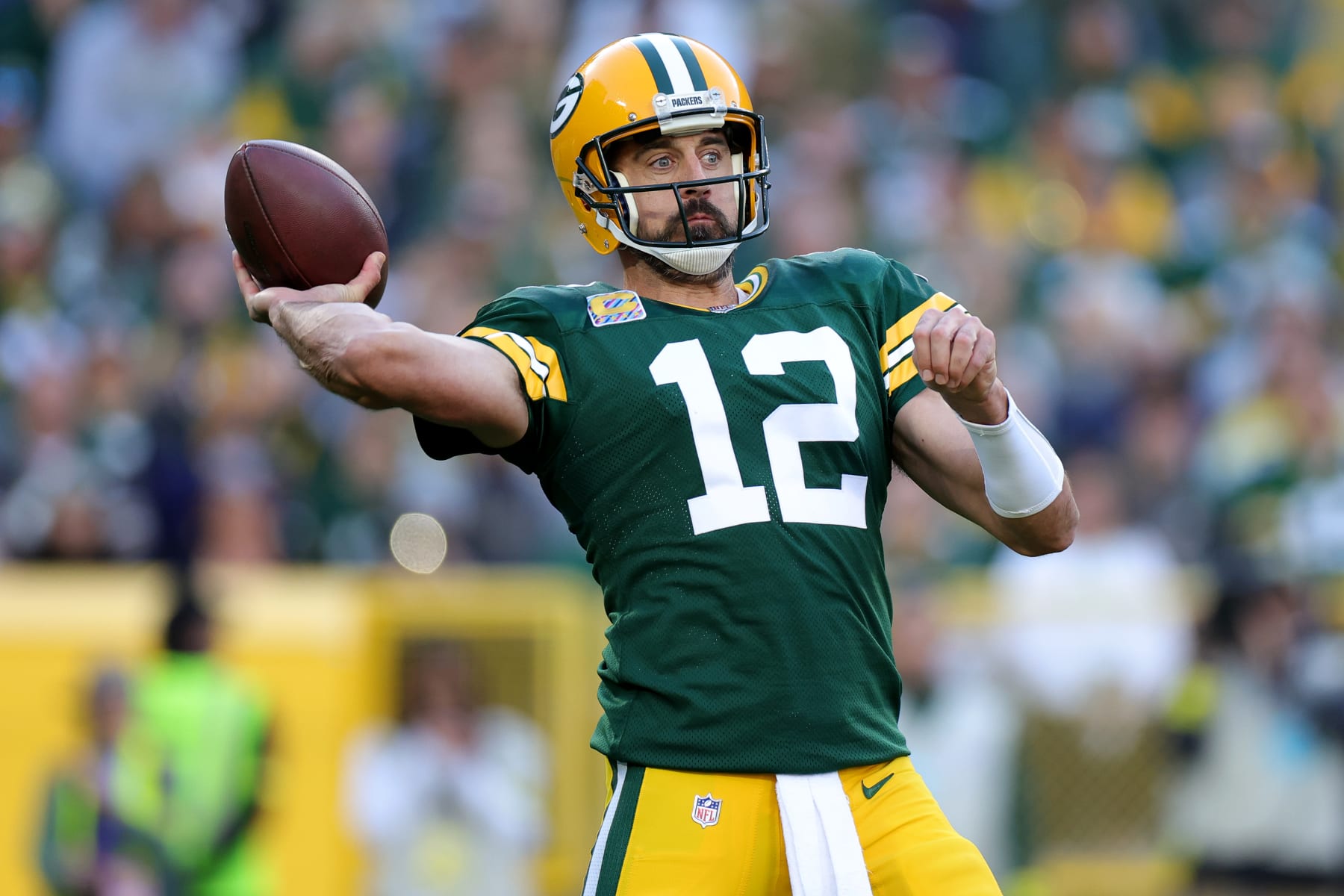 GREEN BAY, WISCONSIN - OCTOBER 02: Aaron Rodgers #12 of the Green Bay Packers attempts a pass during the third quarter against the New England Patriots at Lambeau Field on October 02, 2022 in Green Bay, Wisconsin. (Photo by Stacy Revere/Getty Images)