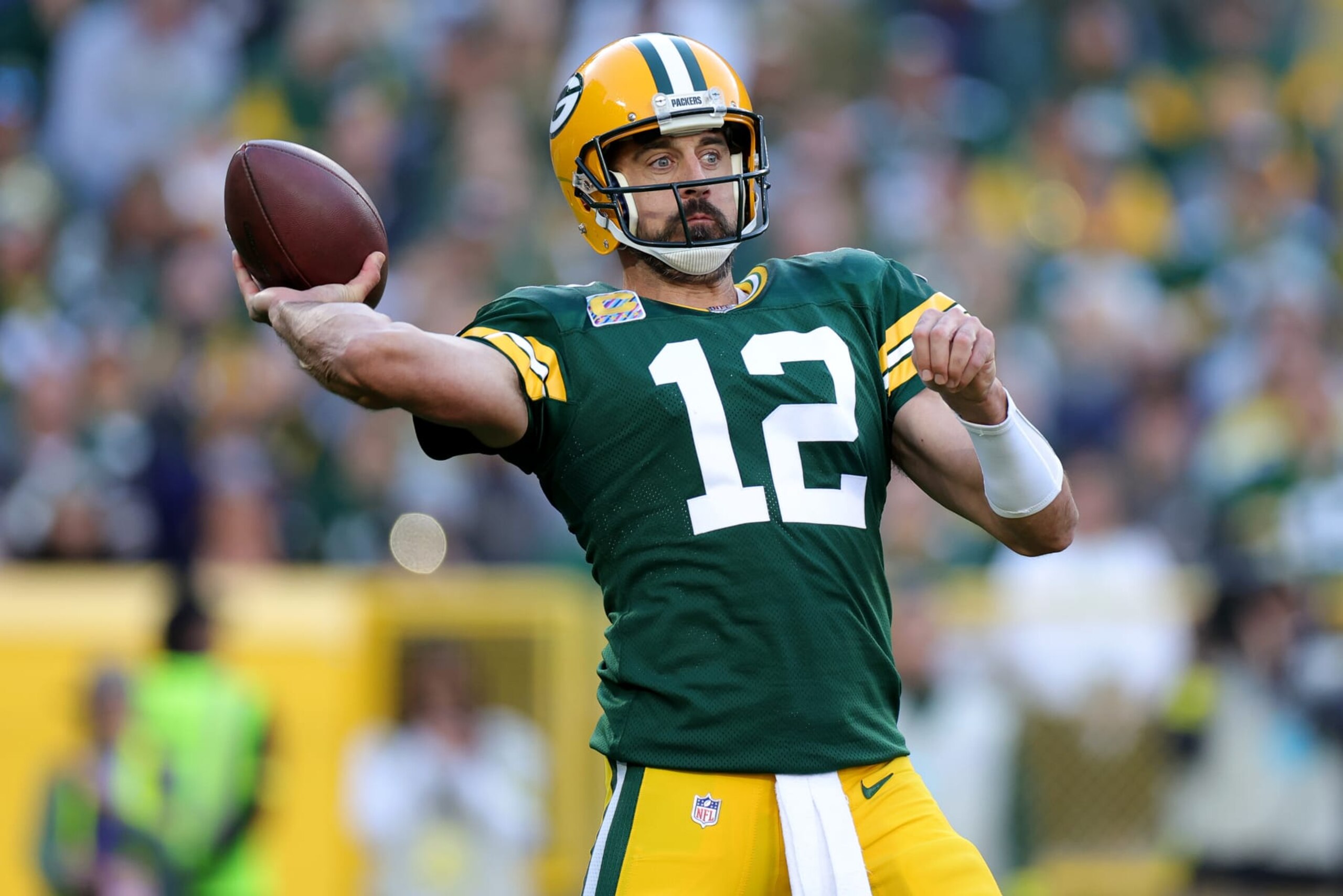 GREEN BAY, WISCONSIN - OCTOBER 02: Aaron Rodgers #12 of the Green Bay Packers attempts a pass during the third quarter against the New England Patriots at Lambeau Field on October 02, 2022 in Green Bay, Wisconsin. (Photo by Stacy Revere/Getty Images)