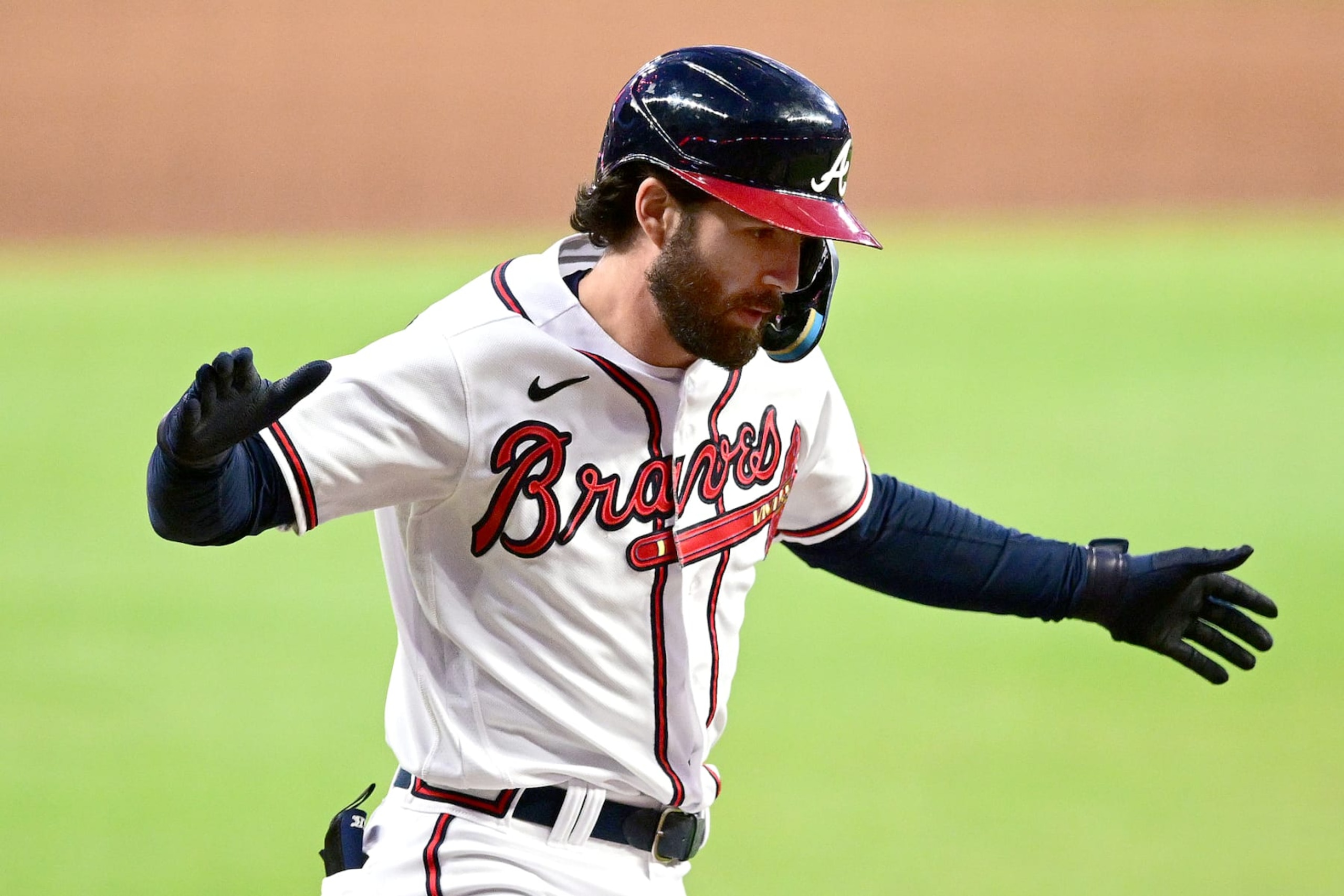 ATLANTA, GA - OCTOBER 2: Dansby Swanson #7 of the Atlanta Braves celebrates after hitting a home run against the New York Mets during the first inning at Truist Park on October 2, 2022 in Atlanta, Georgia. (Photo by Adam Hagy/Getty Images)