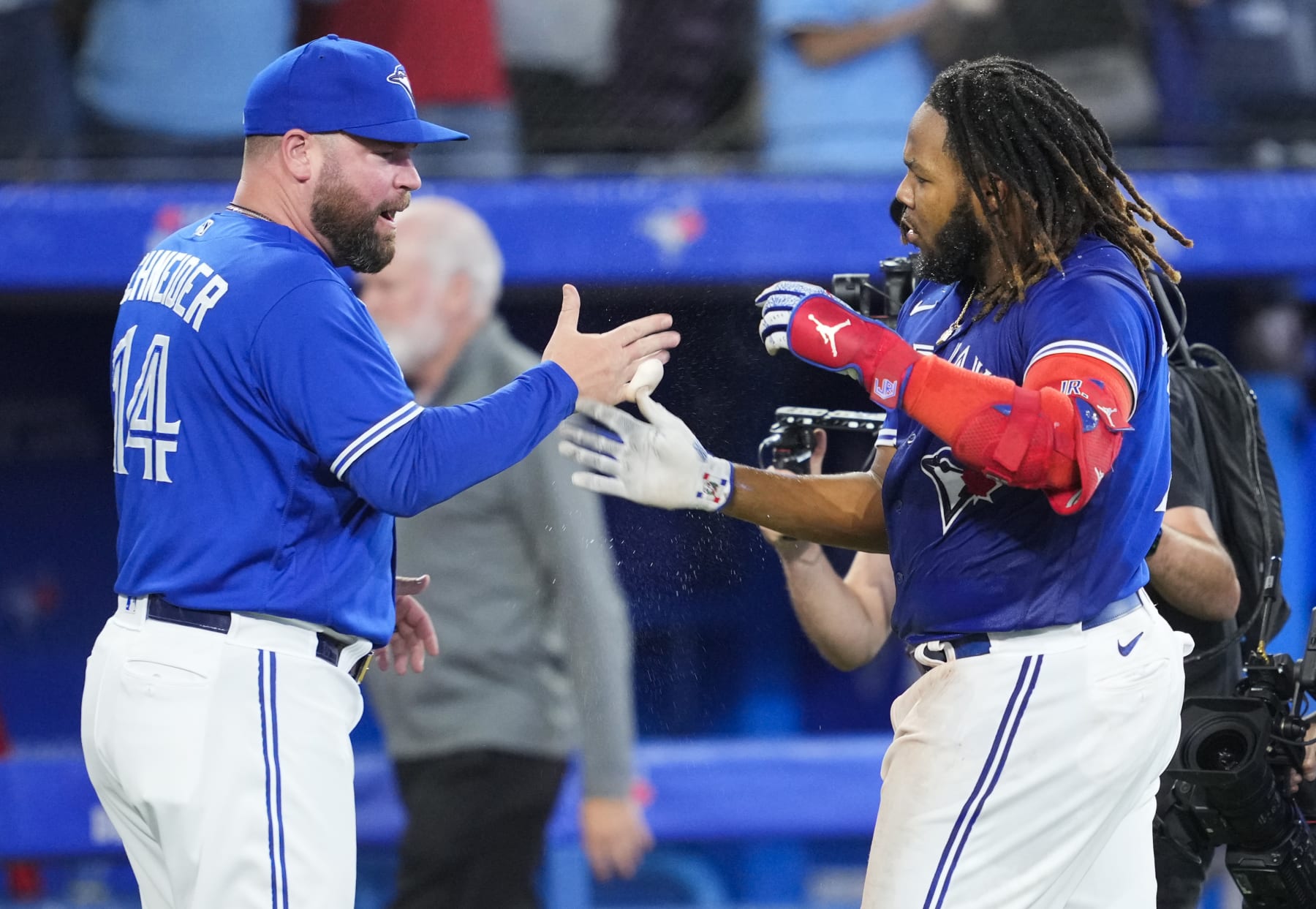 TORONTO, ON - SEPTEMBER 26: Vladimir Guerrero Jr. #27 of the Toronto Blue Jays celebrates on his walk-off hit with manager John Schneider to defeat the the New York Yankees in the tenth inning during their MLB game at the Rogers Centre on September 26, 2022 in Toronto, Ontario, Canada. (Photo by Mark Blinch/Getty Images)