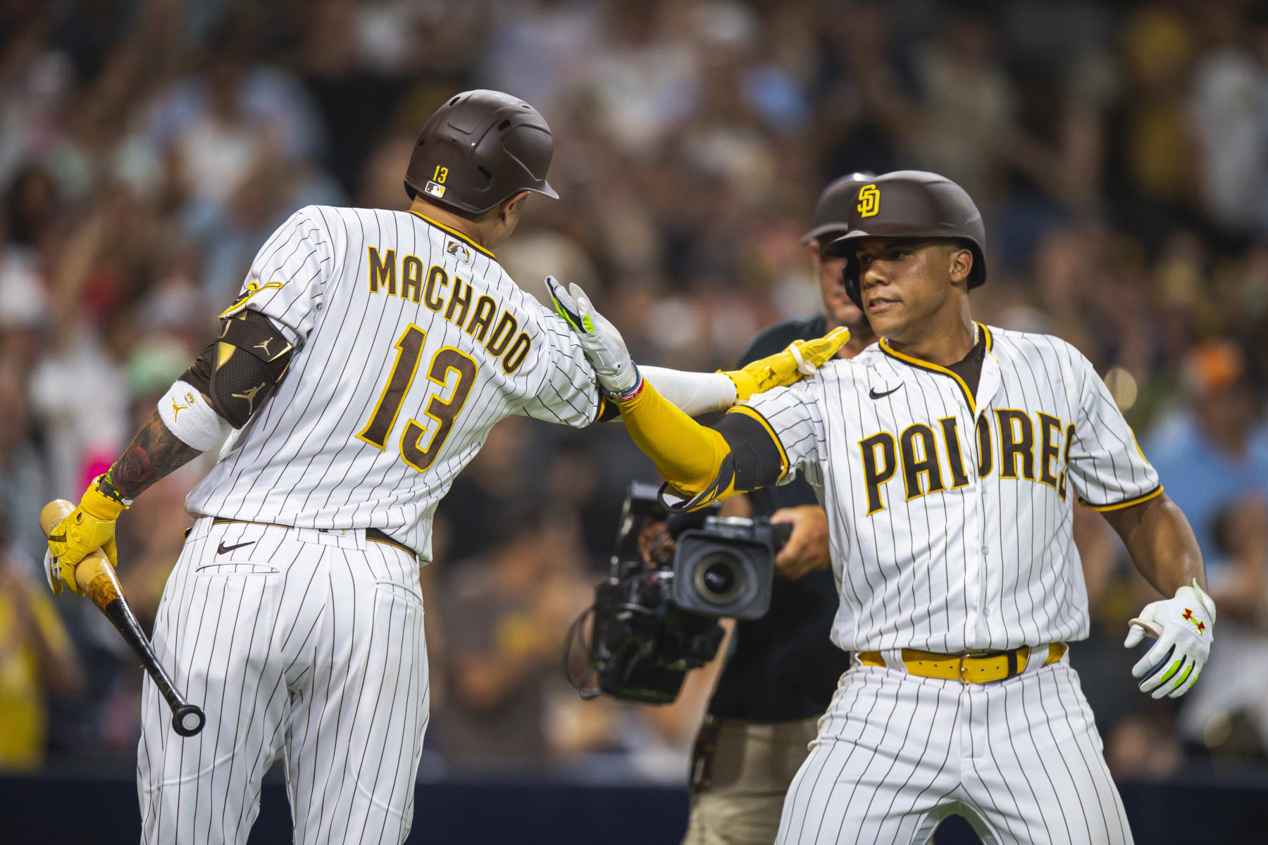 SAN DIEGO, CA - AUGUST 20: Juan Soto #22  celebrates at home plate with Manny Machado #13 of the San Diego Padres after hitting a home run in the seventh inning against the Washington Nationals at the PETCO Park on August 20, 2022 in San Diego, California. (Photo by Matt Thomas/San Diego Padres/Getty Images)