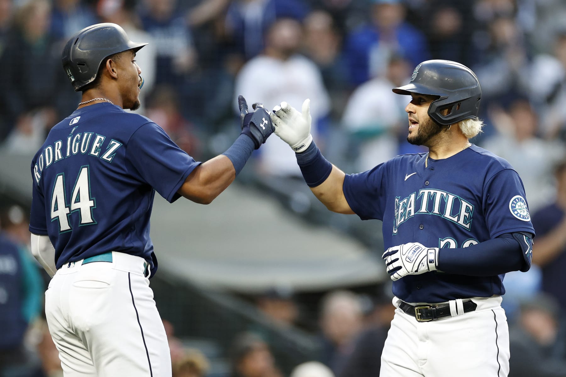 SEATTLE, WASHINGTON - MAY 23: Eugenio Suarez #28 of the Seattle Mariners celebrates his two-run home run with Julio Rodriguez #44 during the fifth inning against the Oakland Athletics at T-Mobile Park on May 23, 2022 in Seattle, Washington. (Photo by Steph Chambers/Getty Images)