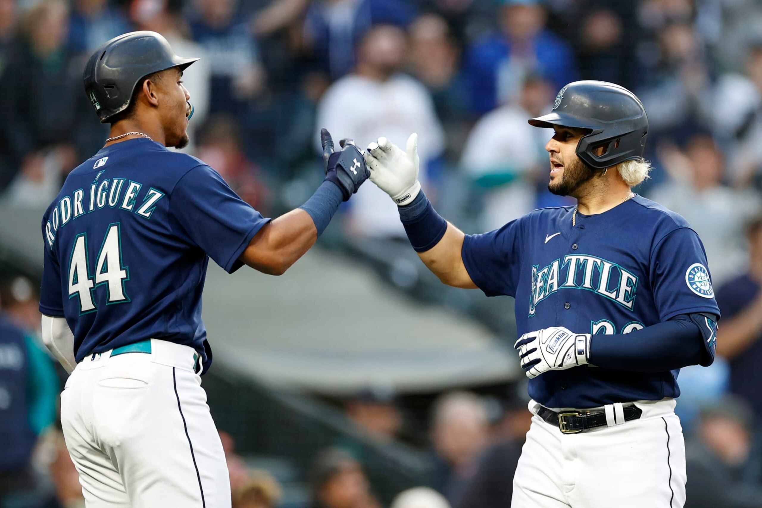 SEATTLE, WASHINGTON - MAY 23: Eugenio Suarez #28 of the Seattle Mariners celebrates his two-run home run with Julio Rodriguez #44 during the fifth inning against the Oakland Athletics at T-Mobile Park on May 23, 2022 in Seattle, Washington. (Photo by Steph Chambers/Getty Images)