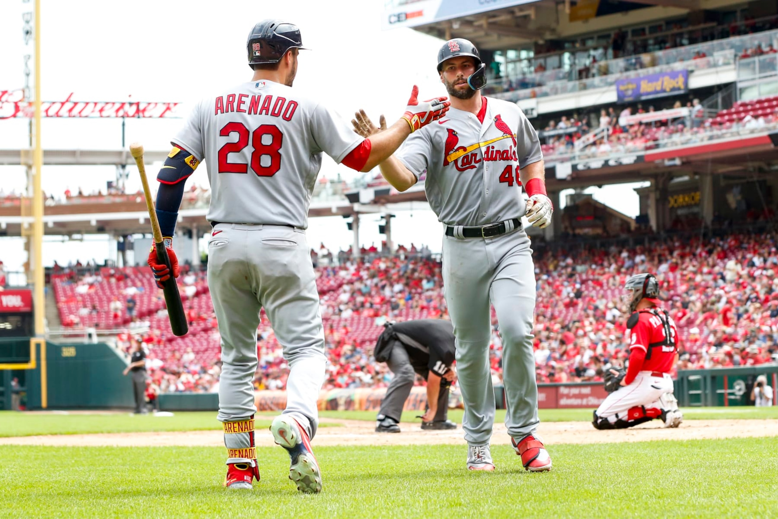 CINCINNATI, OH - JULY 24: Paul Goldschmidt #46 of the St. Louis Cardinals high fives Nolan Arenado #28 of the St. Louis Cardinals after hitting a home run in the top of the fifth inning at Great American Ball Park on July 24, 2022 in Cincinnati, Ohio. (Photo by Lauren Bacho/Getty Images)