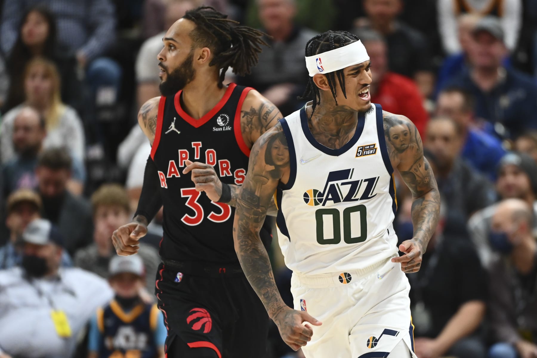SALT LAKE CITY, UTAH - NOVEMBER 18: Jordan Clarkson #00 of the Utah Jazz reacts to a play as Gary Trent Jr. #33 of the Toronto Raptors looks on in the second half during a game against the Toronto Raptors at Vivint Smart Home Arena on November 18, 2021 in Salt Lake City, Utah. NOTE TO USER: User expressly acknowledges and agrees that, by downloading and or using this photograph, User is consenting to the terms and conditions of the Getty Images License Agreement. (Photo by Alex Goodlett/Getty Images)
