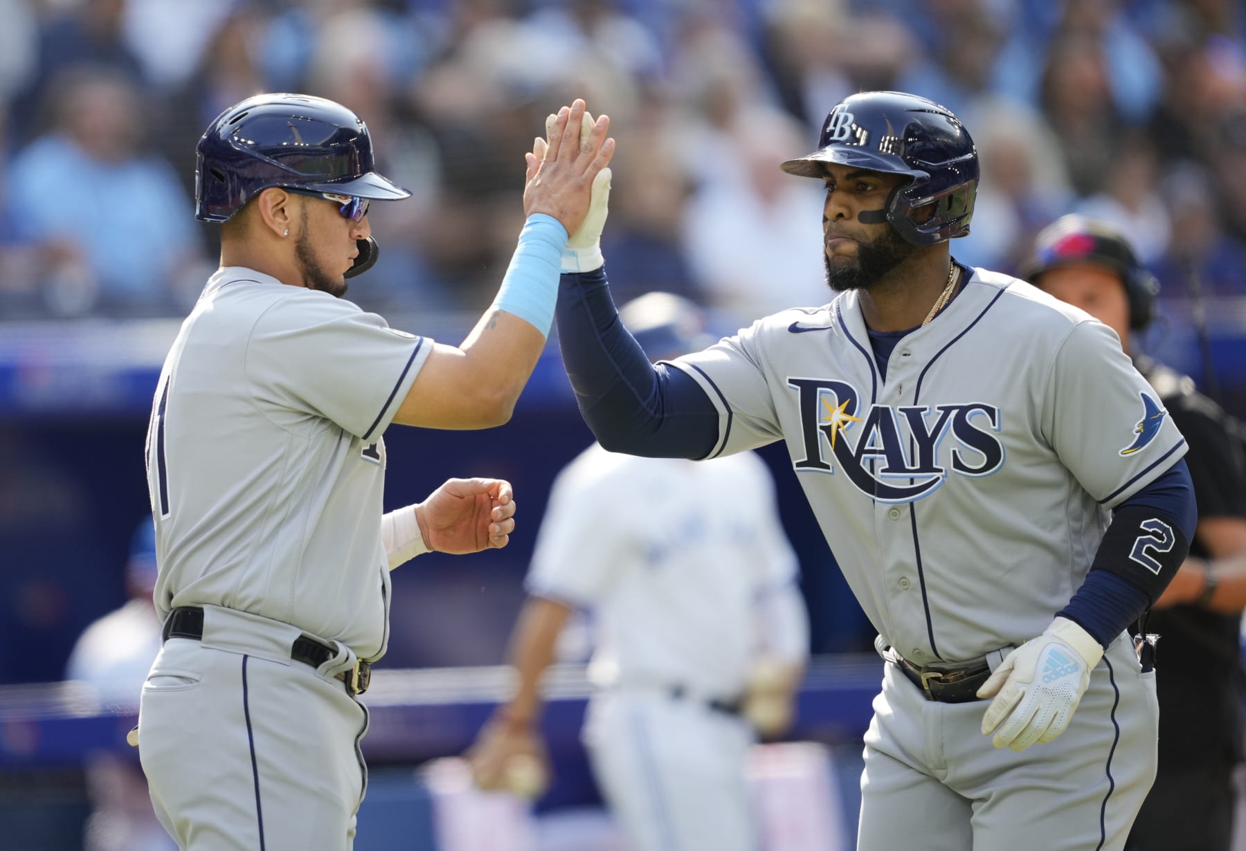 TORONTO, ON - SEPTEMBER 15: Yandy Diaz #2 of the Tampa Bay Rays celebrates his home run with Isaac Paredes #17 against the Toronto Blue Jays in the second inning during their MLB game at the Rogers Centre on September 15, 2022 in Toronto, Ontario, Canada. (Photo by Mark Blinch/Getty Images)