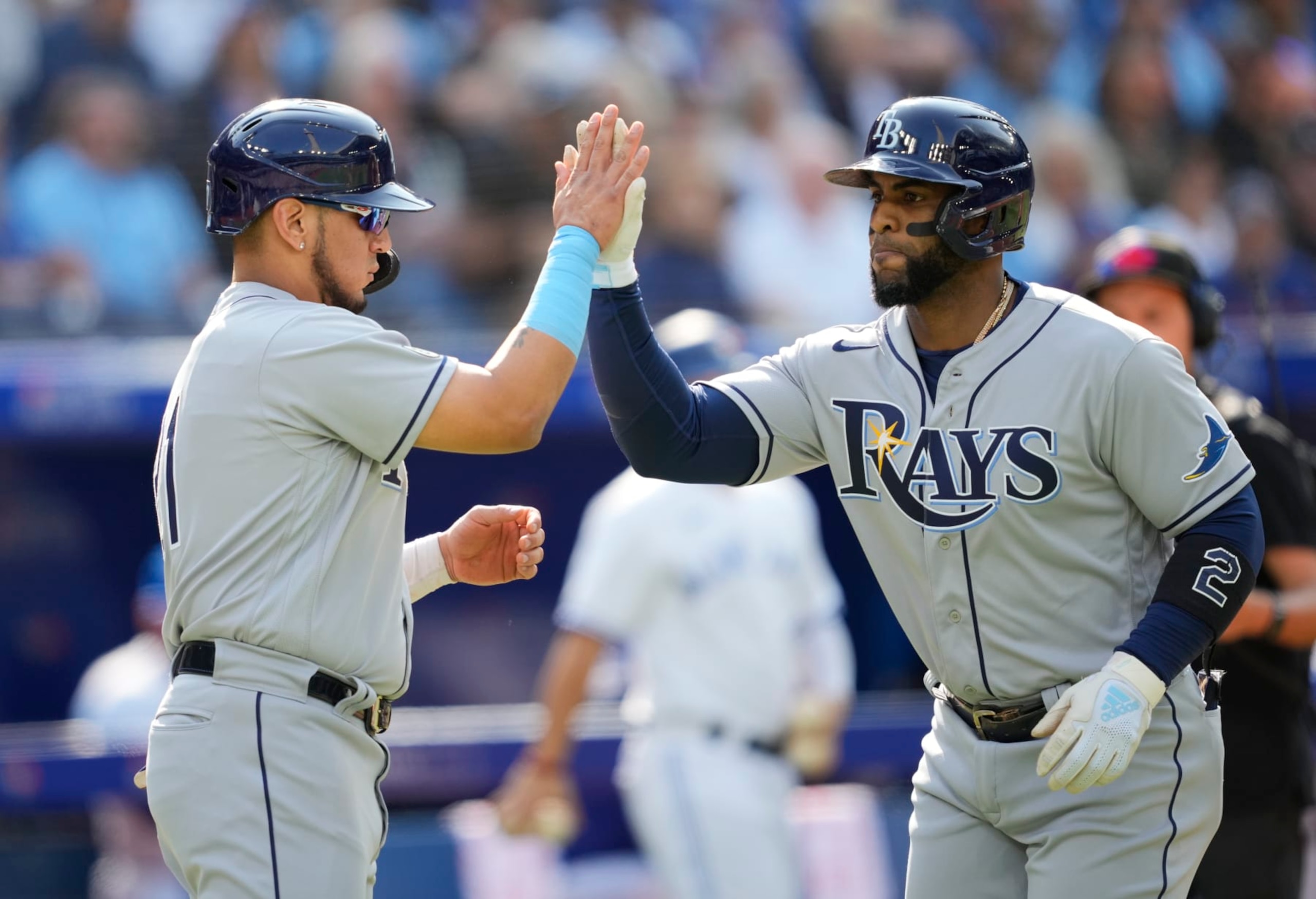 TORONTO, ON - SEPTEMBER 15: Yandy Diaz #2 of the Tampa Bay Rays celebrates his home run with Isaac Paredes #17 against the Toronto Blue Jays in the second inning during their MLB game at the Rogers Centre on September 15, 2022 in Toronto, Ontario, Canada. (Photo by Mark Blinch/Getty Images)