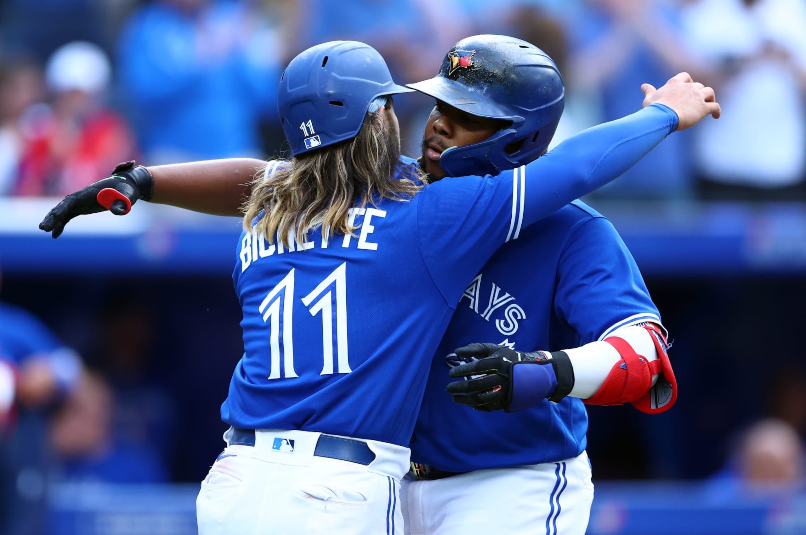 TORONTO, ON - JUNE 27:  Vladimir Guerrero Jr. #27 of the Toronto Blue Jays celebrates with Bo Bichette #11 after hitting a two run home run in the third inning during a MLB game against the Boston Red Sox at Rogers Centre on June 27, 2022 in Toronto, Ontario, Canada.  (Photo by Vaughn Ridley/Getty Images)