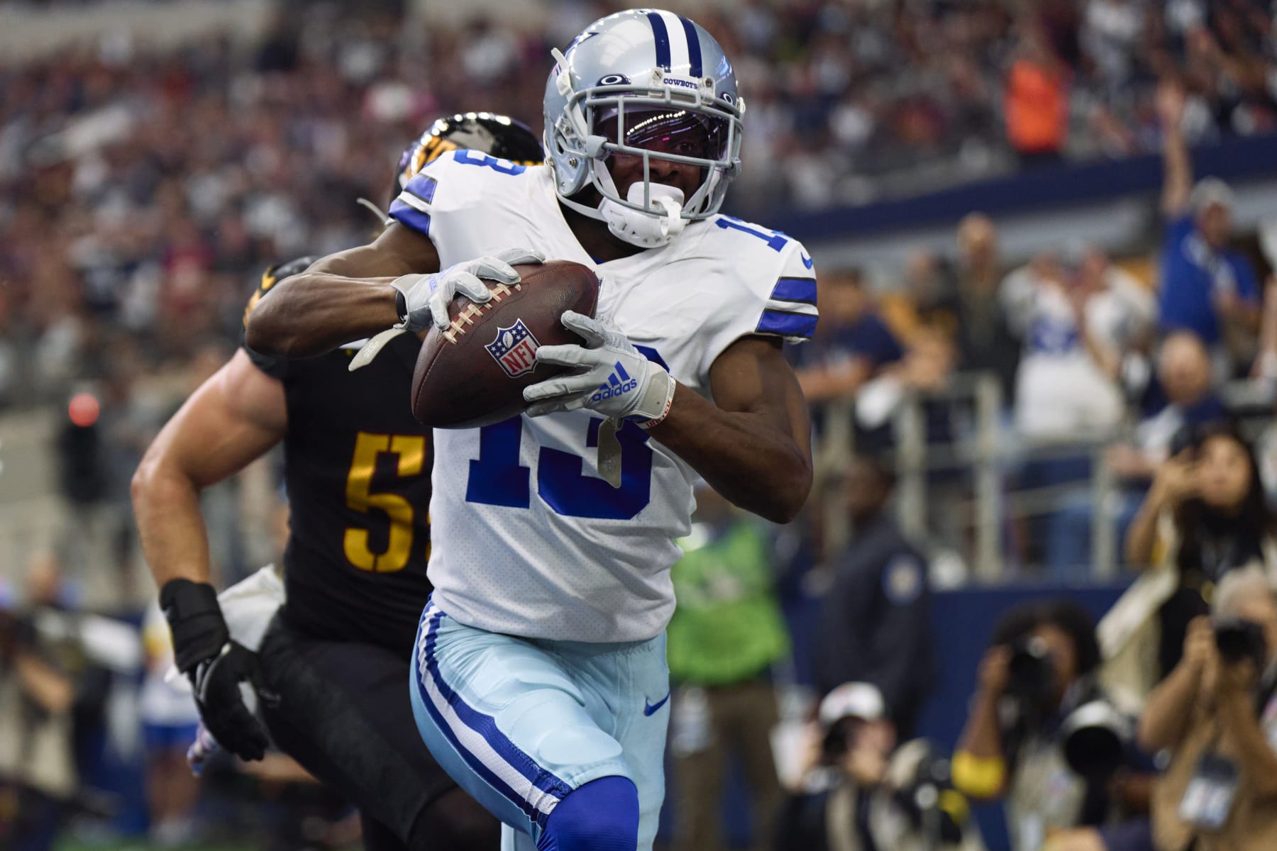 ARLINGTON, TX - OCTOBER 02: Michael Gallup #13 of the Dallas Cowboys scores a touchdown against the Washington Commanders at AT&T Stadium on October 2, 2022 in Arlington, Texas. (Photo by Cooper Neill/Getty Images)