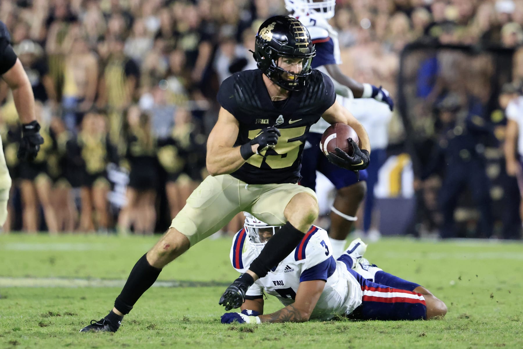 WEST LAFAYETTE, INDIANA - SEPTEMBER 24: Charlie Jones #15 of the Purdue Boilermakers runs the ball after a catch during the second half against the Florida Atlantic Owls at Ross-Ade Stadium on September 24, 2022 in West Lafayette, Indiana. (Photo by Justin Casterline/Getty Images)