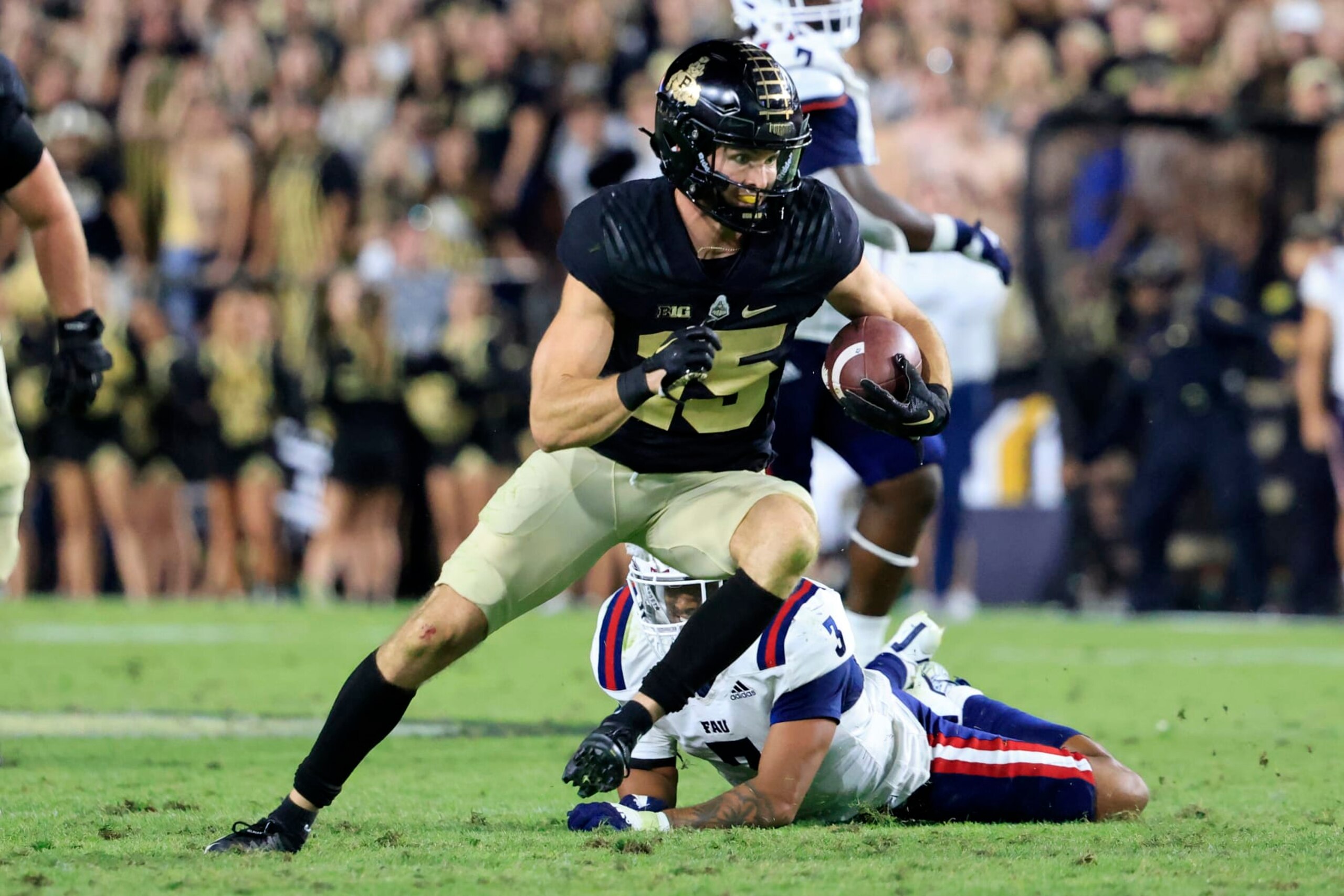 WEST LAFAYETTE, INDIANA - SEPTEMBER 24: Charlie Jones #15 of the Purdue Boilermakers runs the ball after a catch during the second half against the Florida Atlantic Owls at Ross-Ade Stadium on September 24, 2022 in West Lafayette, Indiana. (Photo by Justin Casterline/Getty Images) WEST LAFAYETTE, INDIANA - SEPTEMBER 24: Charlie Jones #15 of the Purdue Boilermakers runs the ball after a catch during the second half against the Florida Atlantic Owls at Ross-Ade Stadium on September 24, 2022 in West Lafayette, Indiana. (Photo by Justin Casterline/Getty Images)