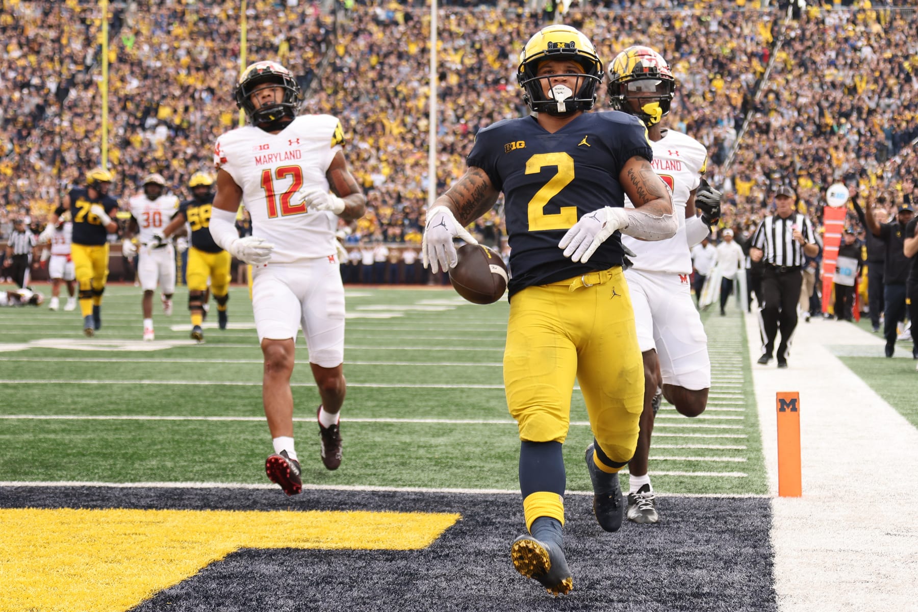ANN ARBOR, MICHIGAN - SEPTEMBER 24: Blake Corum #2 of the Michigan Wolverines scores a fourth quarter touchdown in front of Deonte Banks #3 of the Maryland Terrapins at Michigan Stadium on September 24, 2022 in Ann Arbor, Michigan. Michigan won the game 34-27. (Photo by Gregory Shamus/Getty Images)