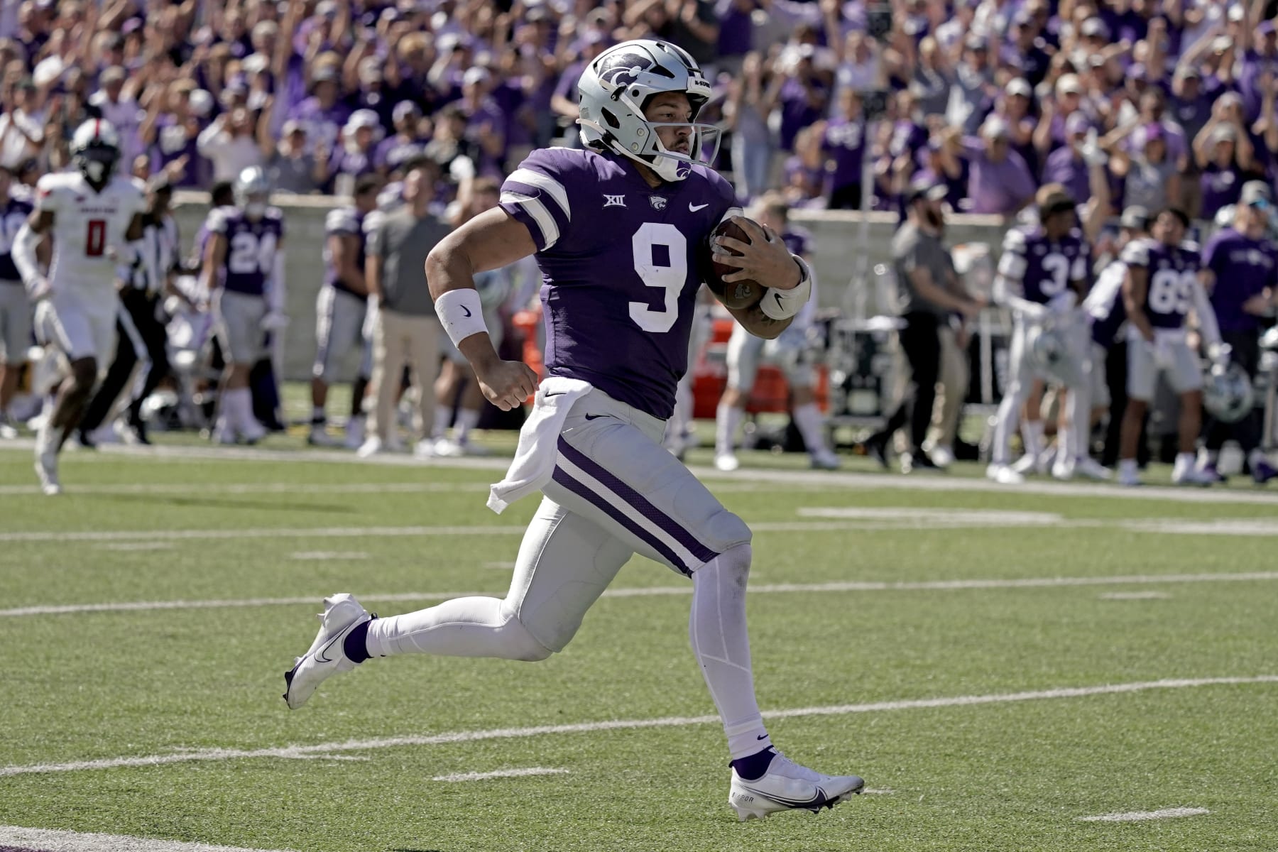 Kansas State quarterback Adrian Martinez runs for a touchdown during the second half of an NCAA college football game against Texas Tech Saturday, Oct. 1, 2022, in Manhattan, Kan. (AP Photo/Charlie Riedel)