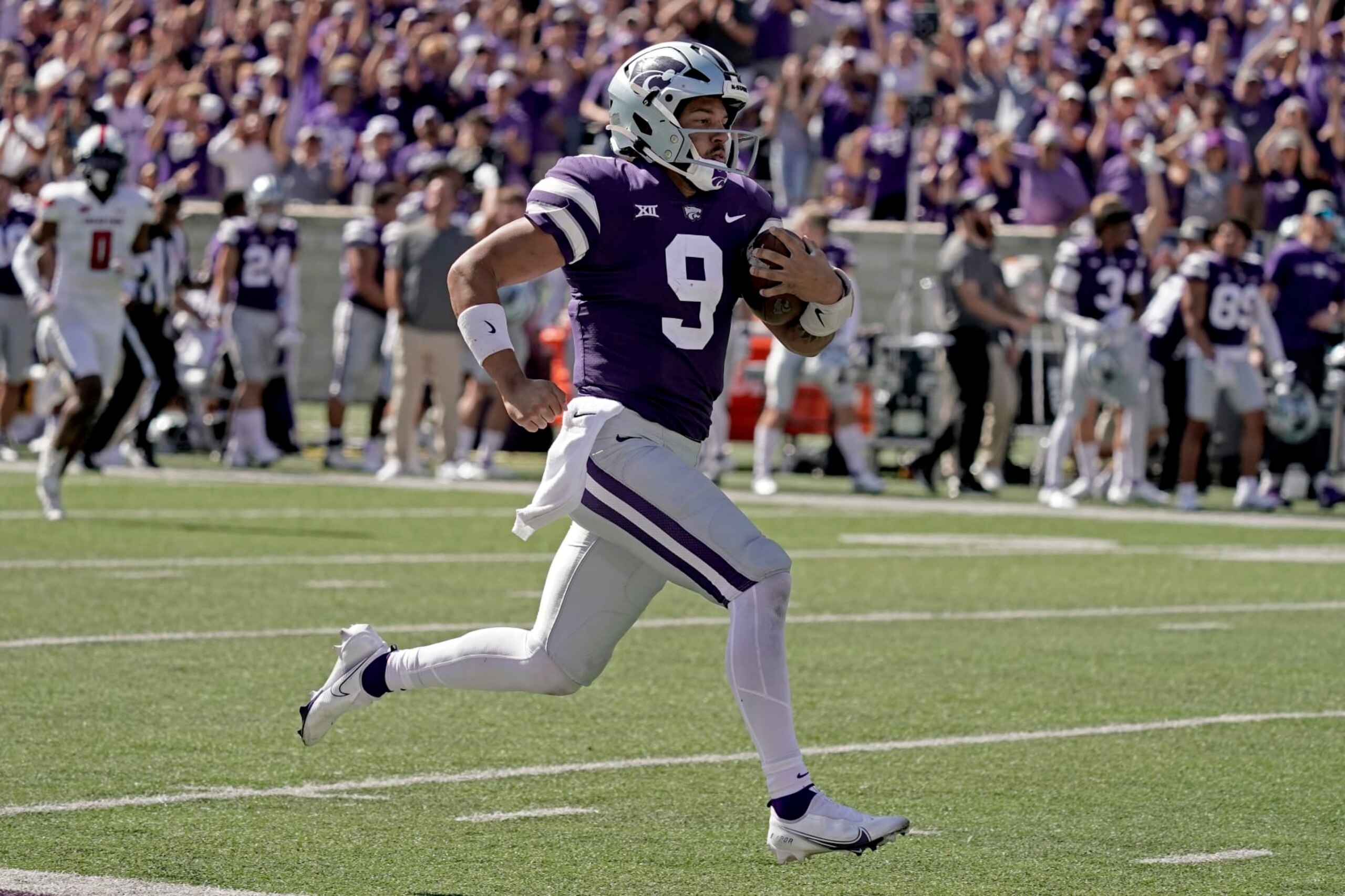 Kansas State quarterback Adrian Martinez runs for a touchdown during the second half of an NCAA college football game against Texas Tech Saturday, Oct. 1, 2022, in Manhattan, Kan. (AP Photo/Charlie Riedel) Kansas State quarterback Adrian Martinez runs for a touchdown during the second half of an NCAA college football game against Texas Tech Saturday, Oct. 1, 2022, in Manhattan, Kan. (AP Photo/Charlie Riedel)