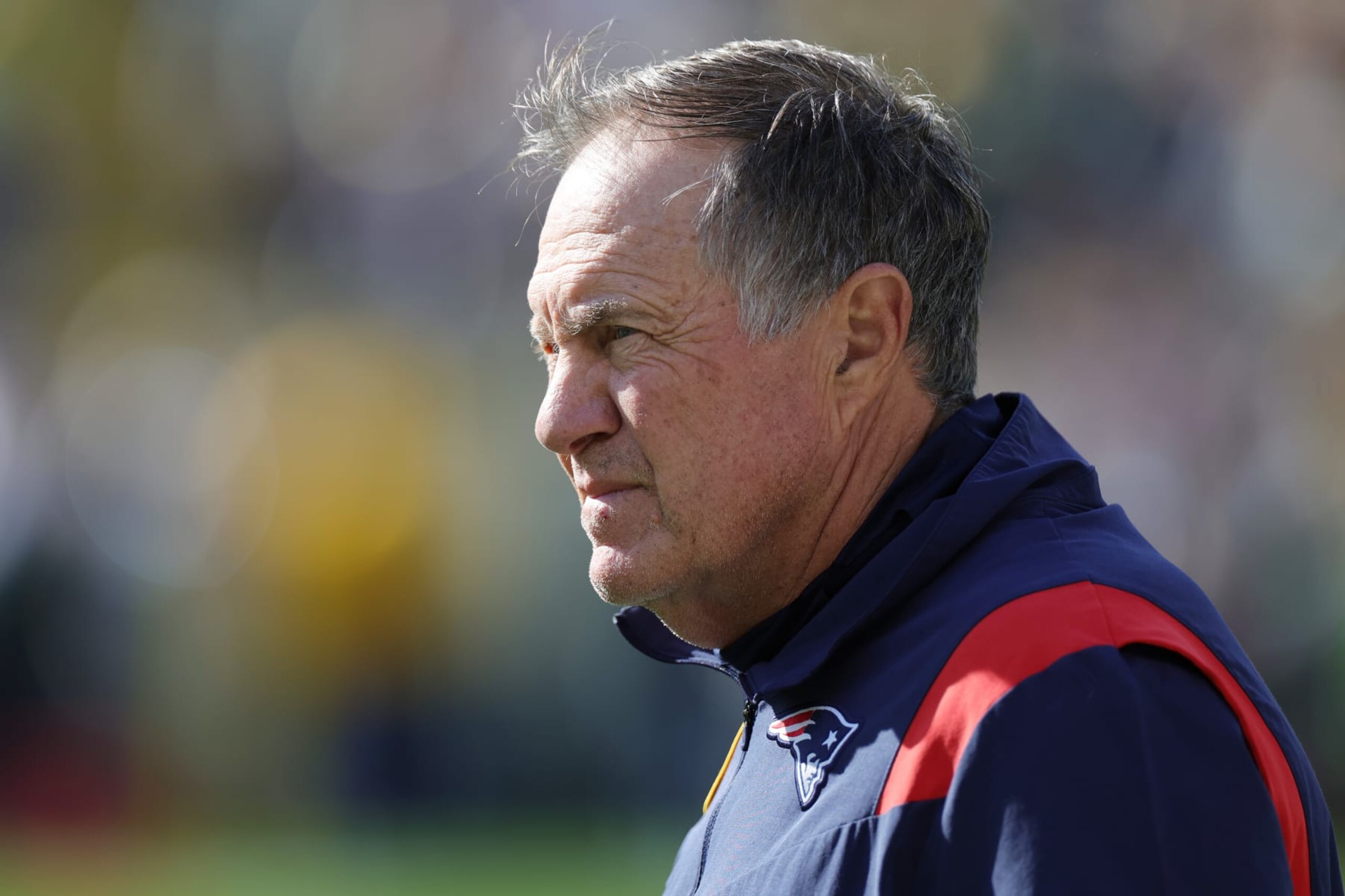GREEN BAY, WISCONSIN - OCTOBER 02: Head coach Bill Belichick of the New England Patriots looks onward during pregame against the Green Bay Packers at Lambeau Field on October 02, 2022 in Green Bay, Wisconsin. (Photo by Stacy Revere/Getty Images)