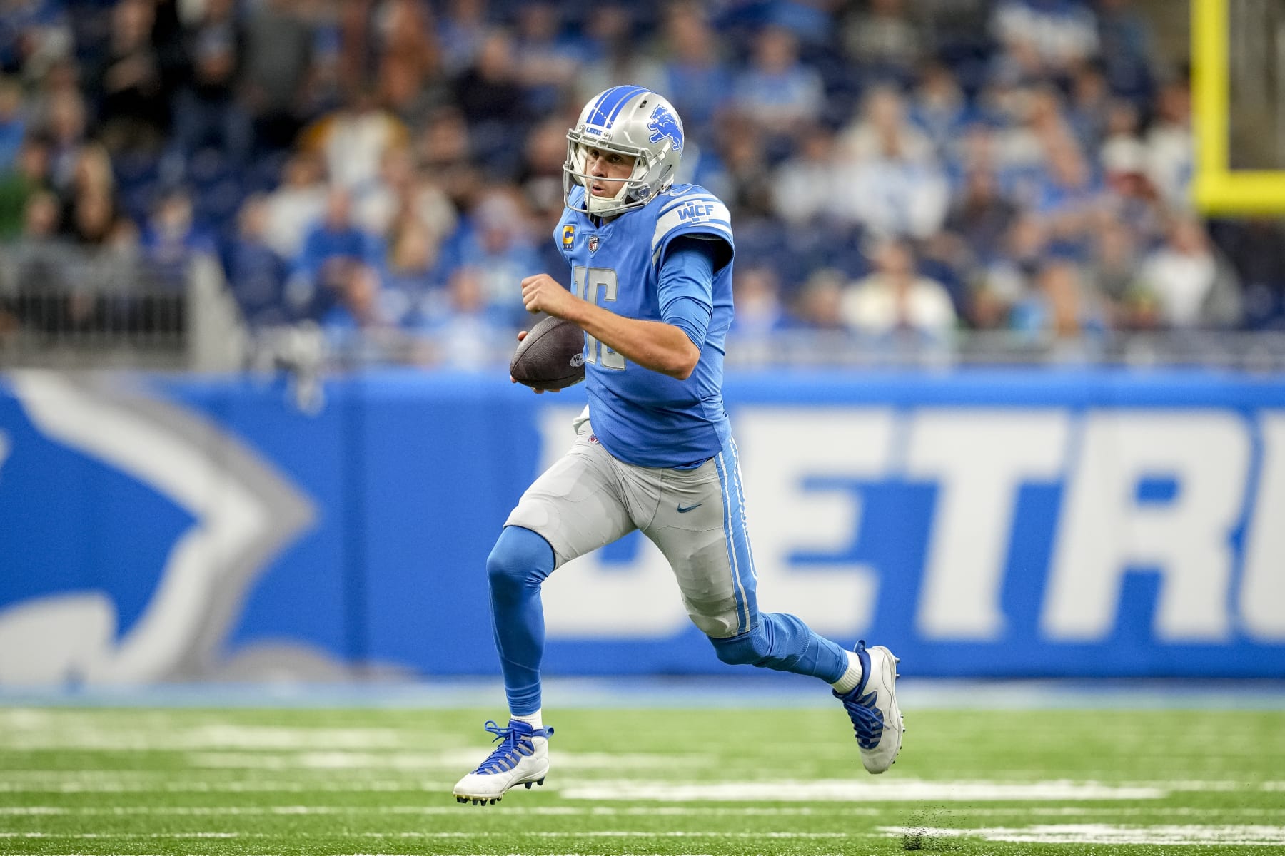 DETROIT, MICHIGAN - OCTOBER 02: Jared Goff #16 of the Detroit Lions runs the ball against the Seattle Seahawks at Ford Field on October 2, 2022 in Detroit, Michigan. (Photo by Nic Antaya/Getty Images)