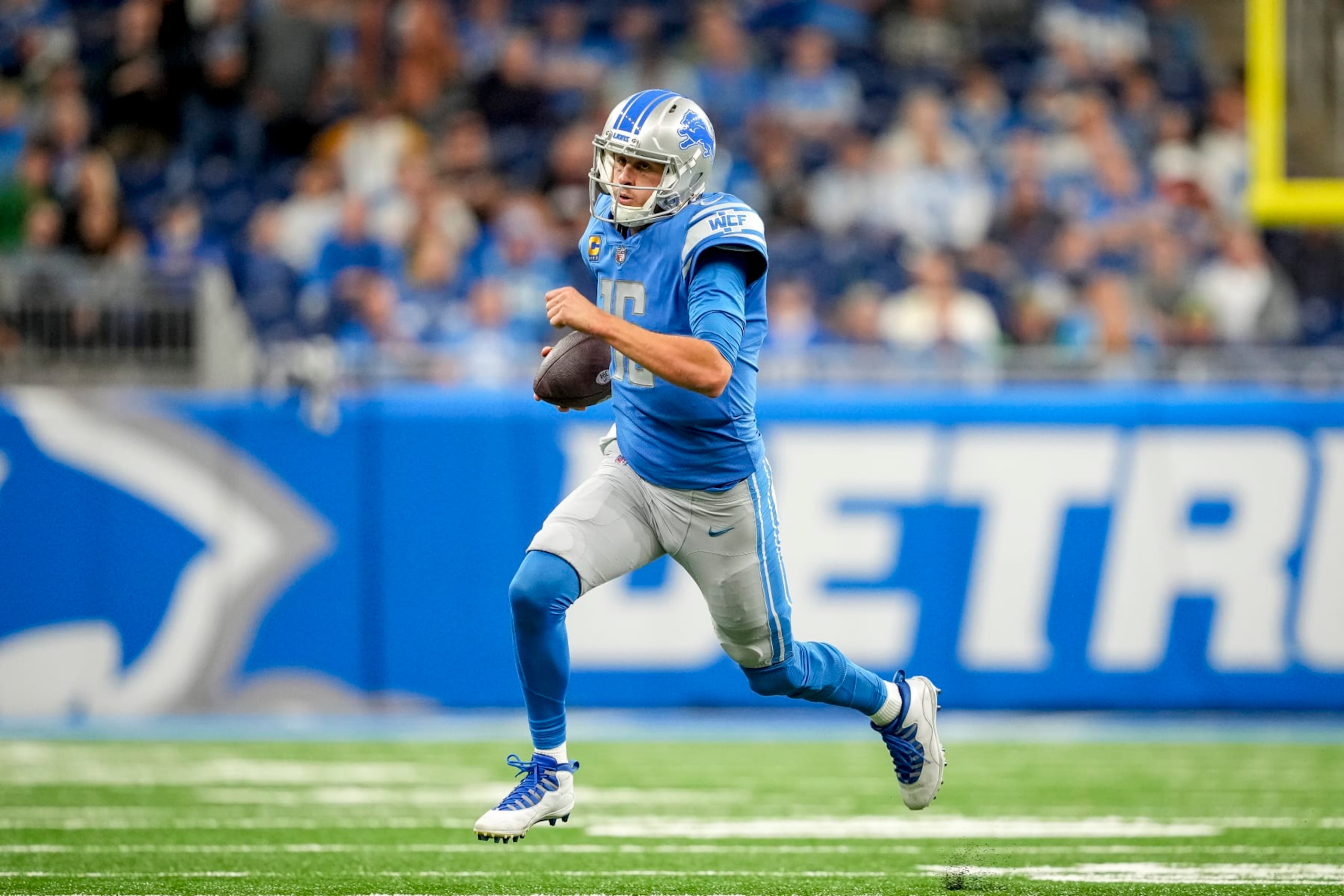 DETROIT, MICHIGAN - OCTOBER 02: Jared Goff #16 of the Detroit Lions runs the ball against the Seattle Seahawks at Ford Field on October 2, 2022 in Detroit, Michigan. (Photo by Nic Antaya/Getty Images)