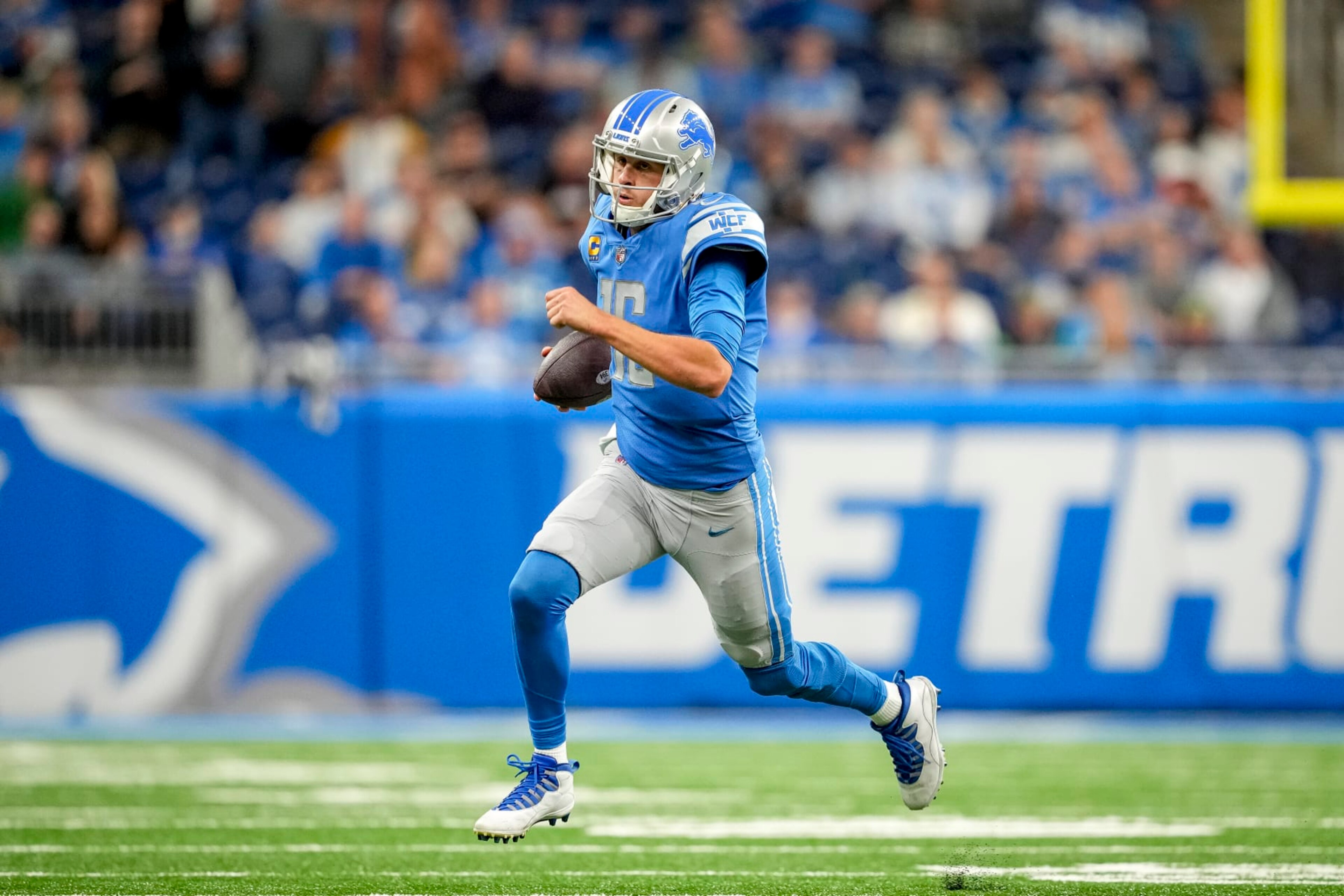 DETROIT, MICHIGAN - OCTOBER 02: Jared Goff #16 of the Detroit Lions runs the ball against the Seattle Seahawks at Ford Field on October 2, 2022 in Detroit, Michigan. (Photo by Nic Antaya/Getty Images)