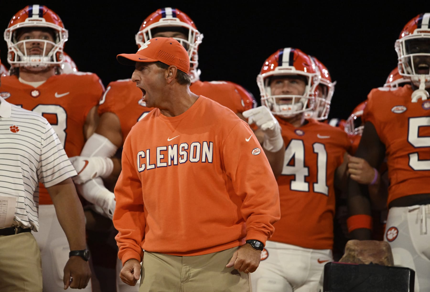 CLEMSON, SOUTH CAROLINA - OCTOBER 01: Head coach Dabo Swinney of the Clemson Tigers cheers with his team before running onto the field before the game against the North Carolina State Wolfpack at Memorial Stadium on October 01, 2022 in Clemson, South Carolina. (Photo by Eakin Howard/Getty Images)
