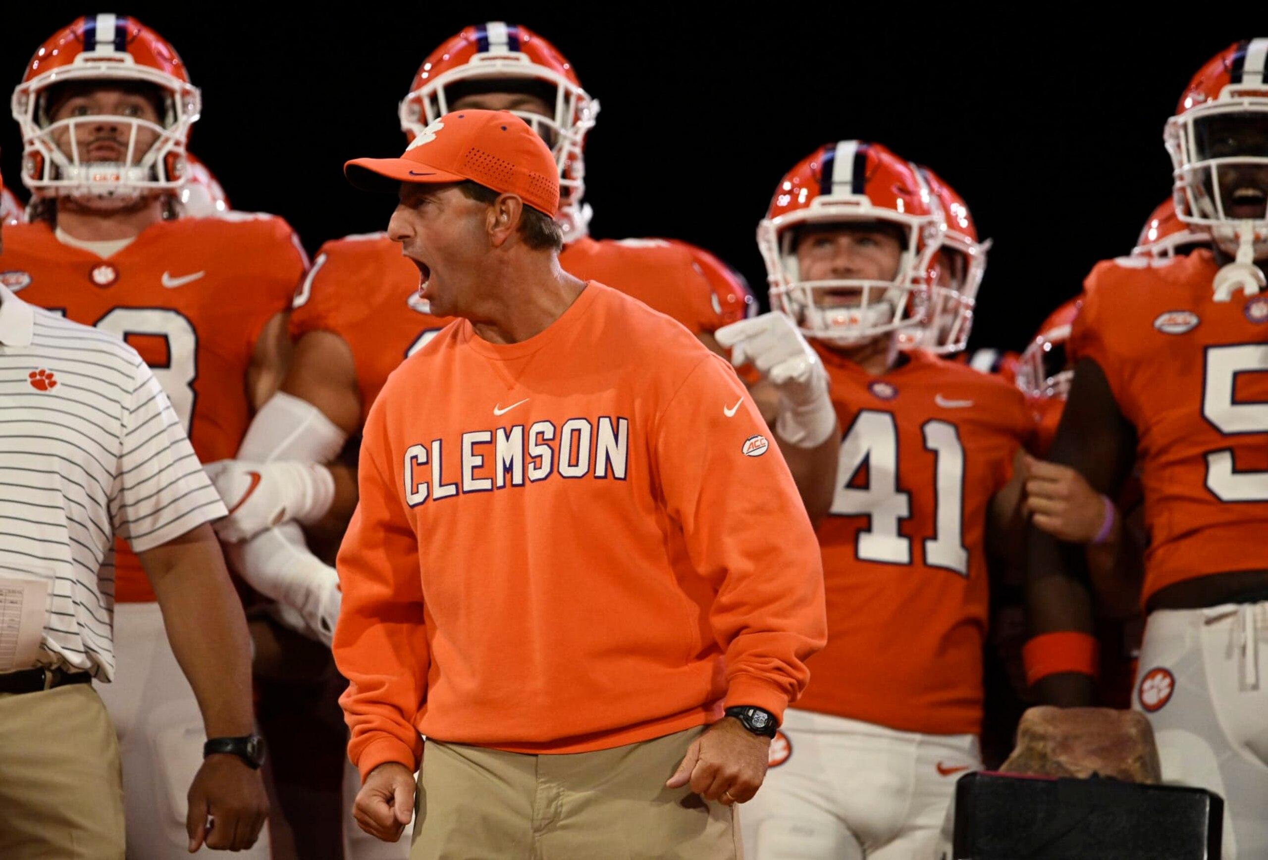 CLEMSON, SOUTH CAROLINA - OCTOBER 01: Head coach Dabo Swinney of the Clemson Tigers cheers with his team before running onto the field before the game against the North Carolina State Wolfpack at Memorial Stadium on October 01, 2022 in Clemson, South Carolina. (Photo by Eakin Howard/Getty Images)