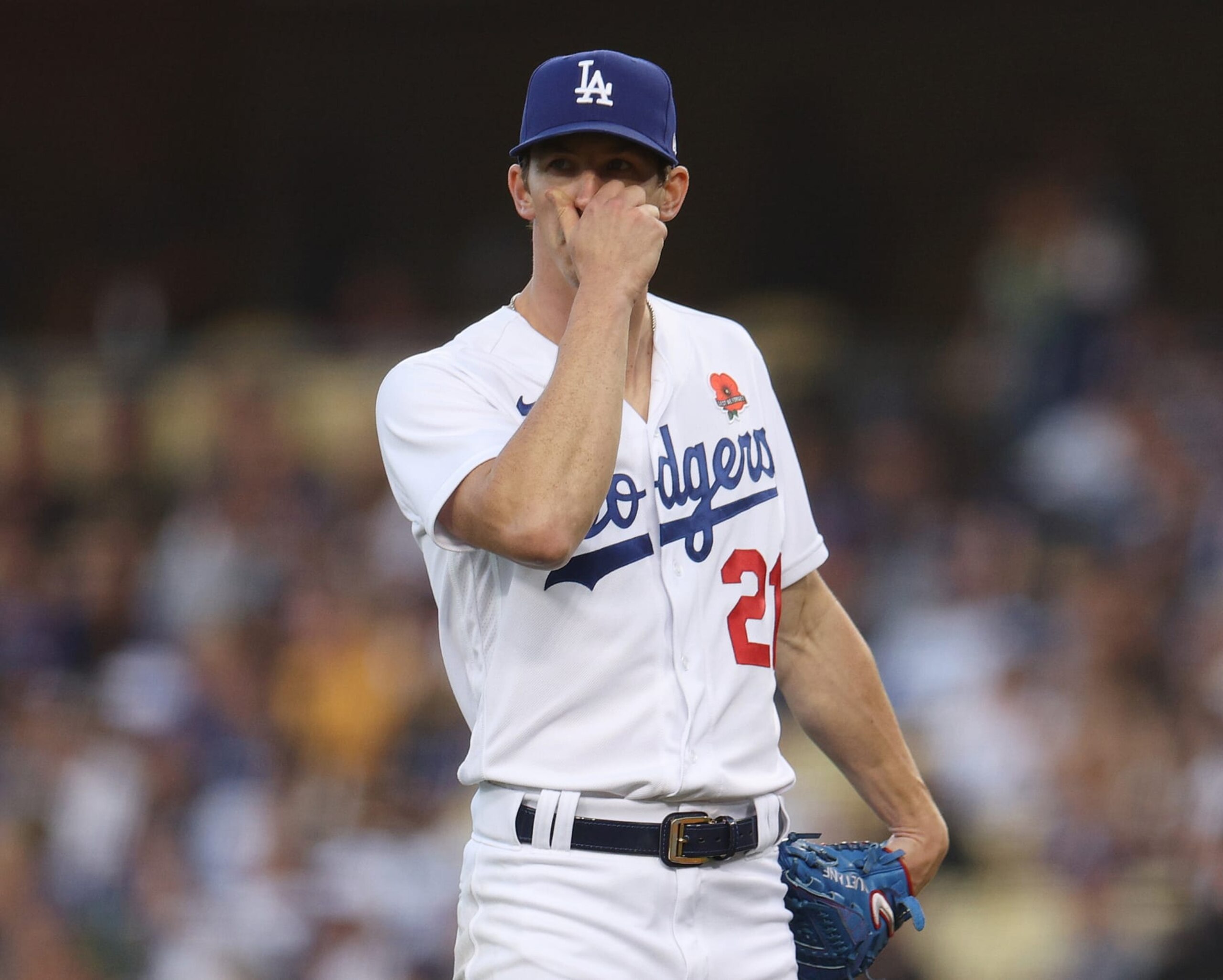 LOS ANGELES, CALIFORNIA - MAY 30: Walker Buehler #21 of the Los Angeles Dodgers reacts after a three run homerun to Tucupita Marcano #30 of the Pittsburgh Pirates, to trail 3-0, during the second inning at Dodger Stadium on May 30, 2022 in Los Angeles, California. (Photo by Harry How/Getty Images)