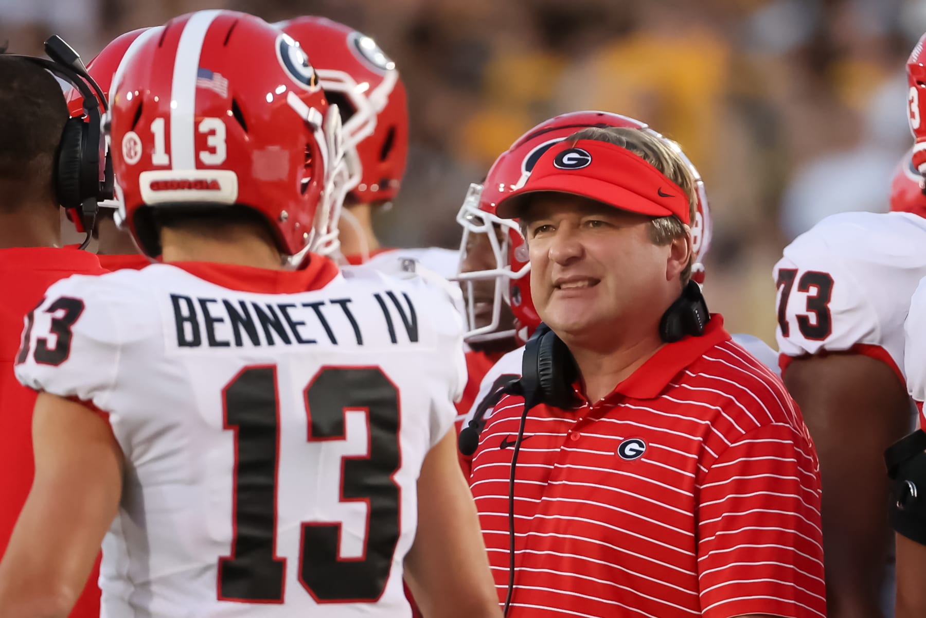 COLUMBIA, MO - OCTOBER 01: Georgia Bulldogs head coach Kirby Smart talks with quarterback Stetson Bennett (13) on the sidelines during an SEC game between the Georgia Bulldogs and Missouri Tigers on October 1, 2022 at Memorial Stadium at Faurot Field in Columbia, MO.  Photo by Scott Winters/Icon Sportswire via Getty Images)