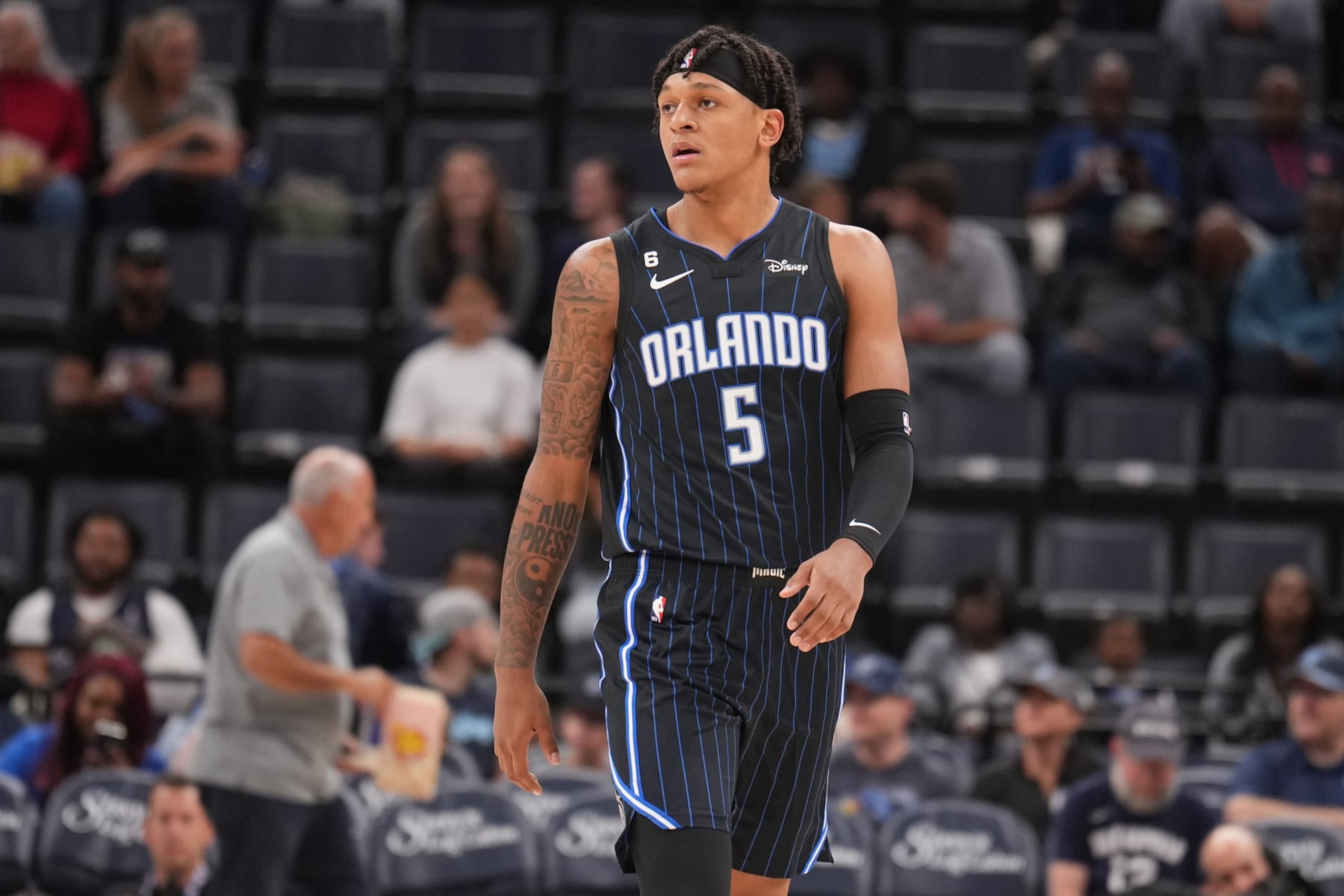 MEMPHIS, TN - OCTOBER 3: Paolo Banchero #5 of the Orlando Magic looks on during a preseason game on October 3, 2022 at FedExForum in Memphis, Tennessee. NOTE TO USER: User expressly acknowledges and agrees that, by downloading and or using this photograph, User is consenting to the terms and conditions of the Getty Images License Agreement. Mandatory Copyright Notice: Copyright 2022 NBAE (Photo by Jesse D. Garrabrant/NBAE via Getty Images)