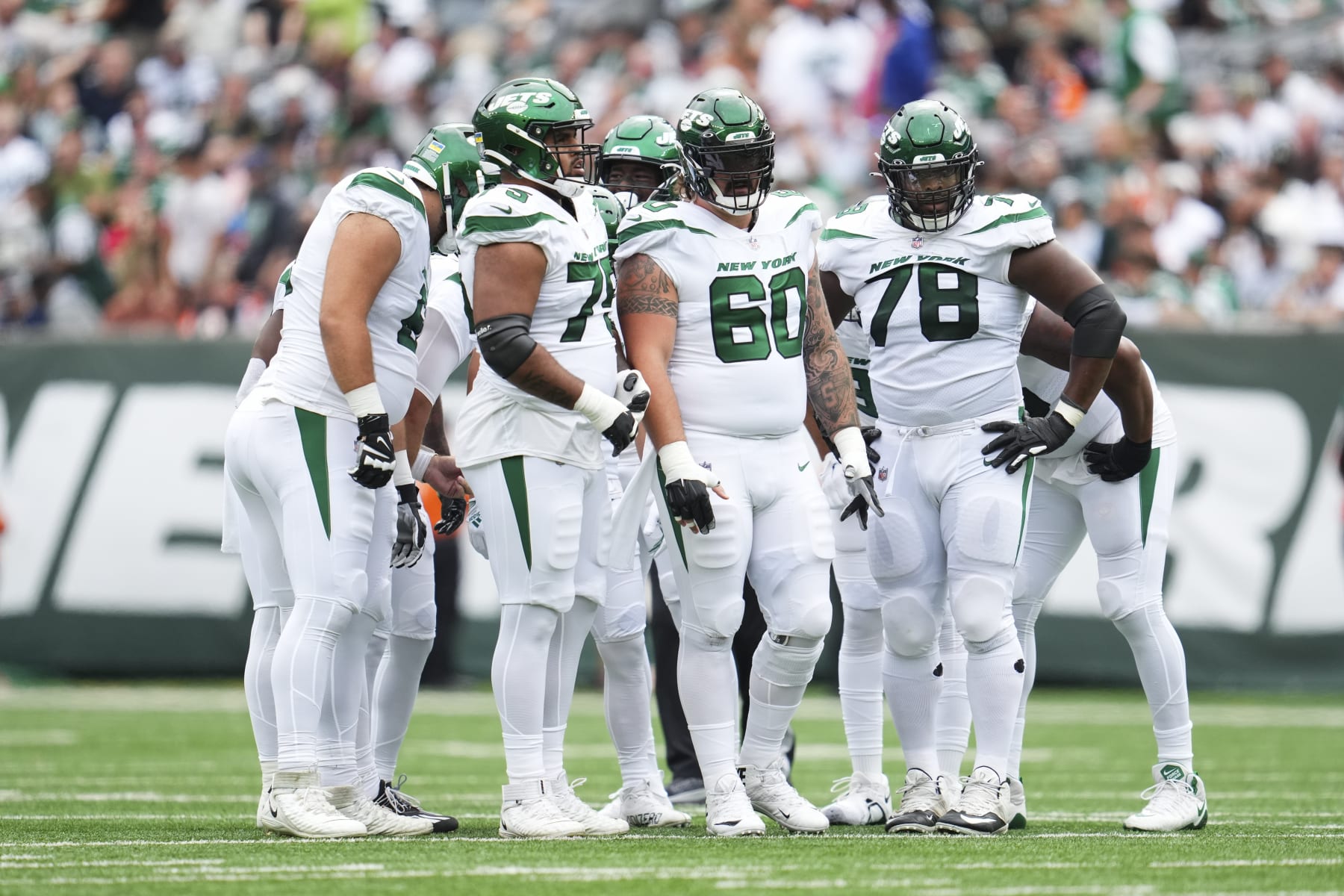 EAST RUTHERFORD, NJ - SEPTEMBER 25: New York Jets offensive line looks down field against the Cincinnati Bengals at MetLife Stadium on September 25, 2022 in East Rutherford, New Jersey. (Photo by Cooper Neill/Getty Images)