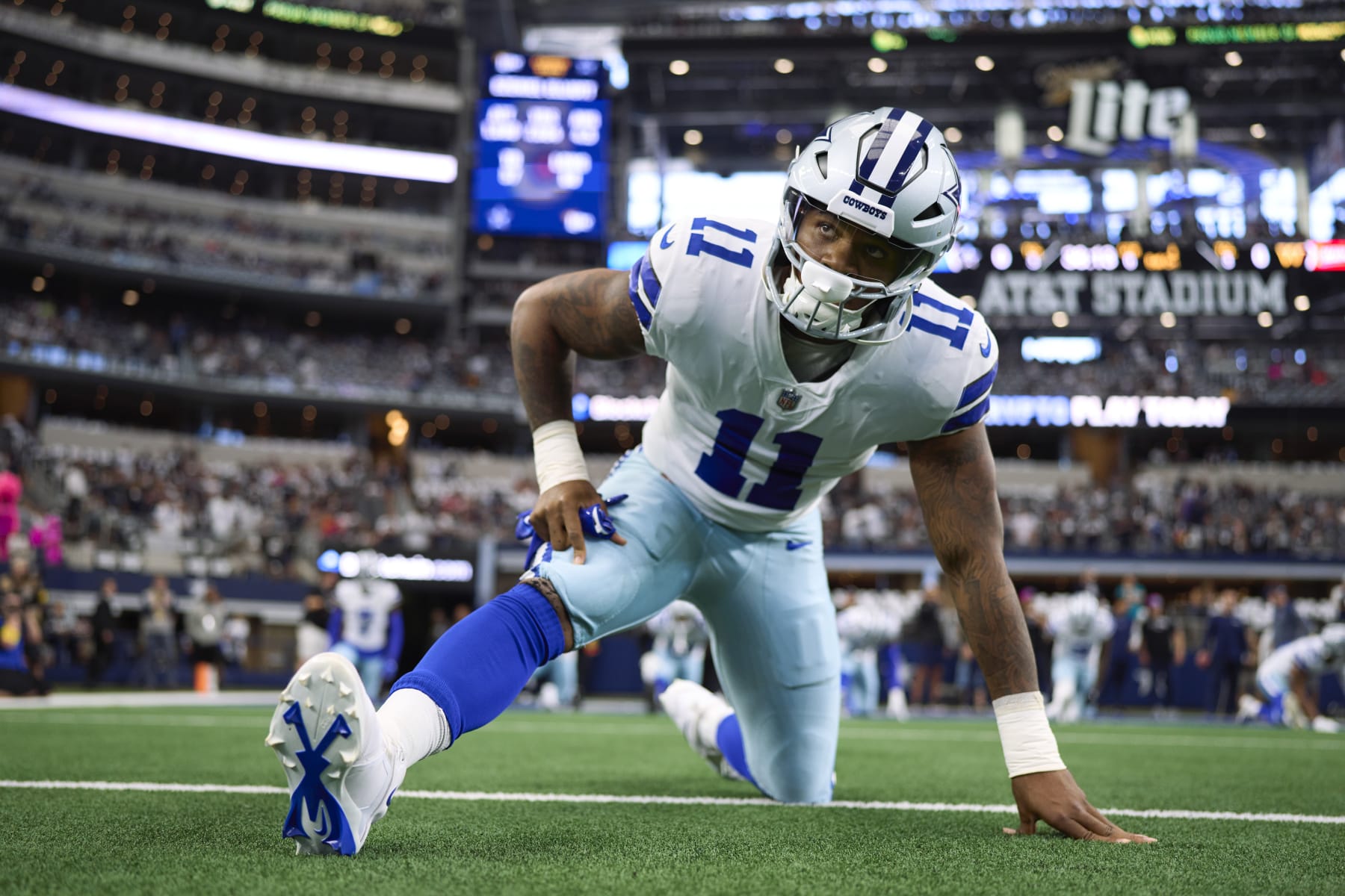 ARLINGTON, TX - OCTOBER 02: Micah Parsons #11 of the Dallas Cowboys warms up before kickoff against the Washington Commanders at AT&T Stadium on October 2, 2022 in Arlington, Texas. (Photo by Cooper Neill/Getty Images)