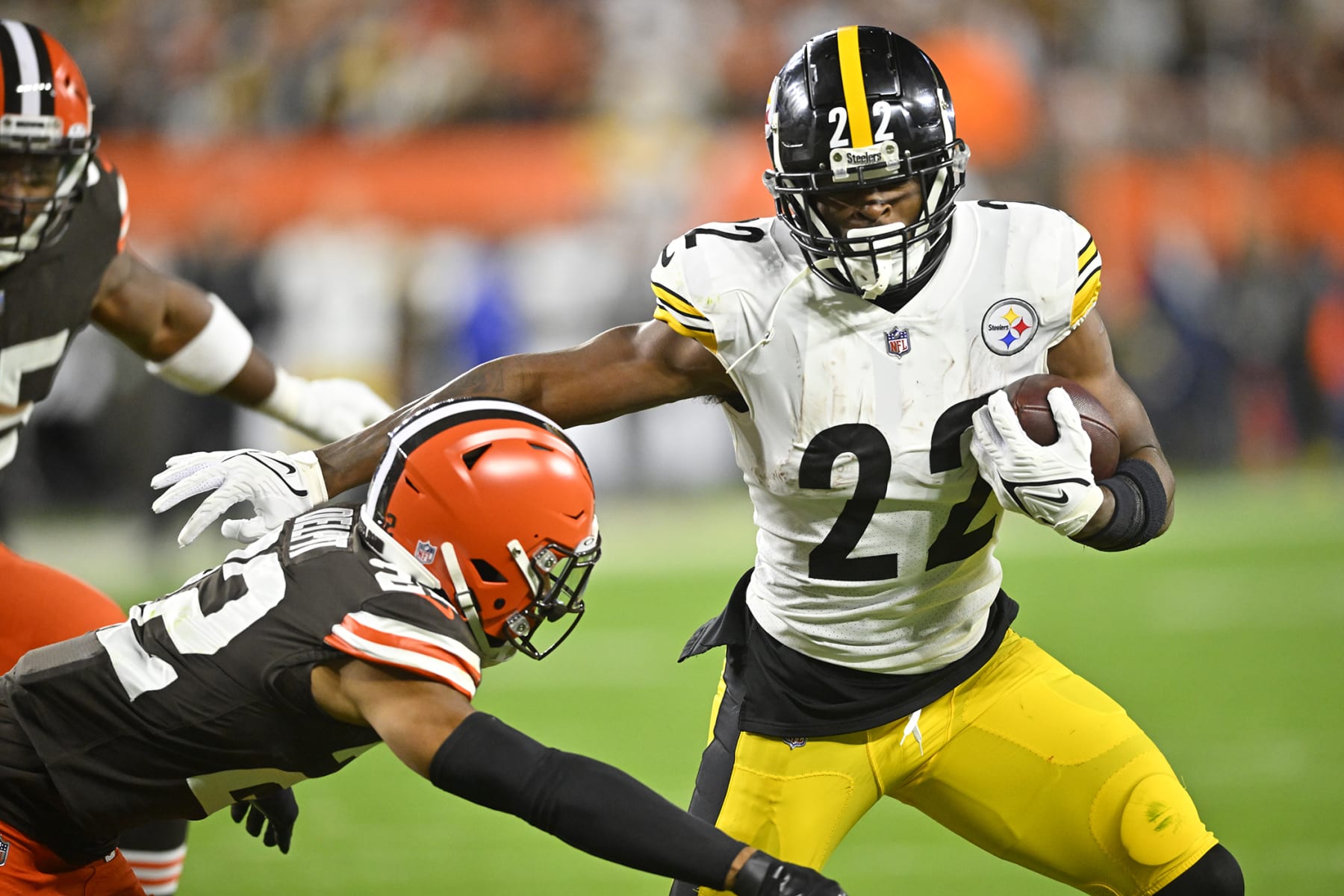 Pittsburgh Steelers running back Najee Harris (22) gets around Cleveland Browns safety Grant Delpit (22) during the first half of an NFL football game in Cleveland, Thursday, Sept. 22, 2022. (AP Photo/David Richard)