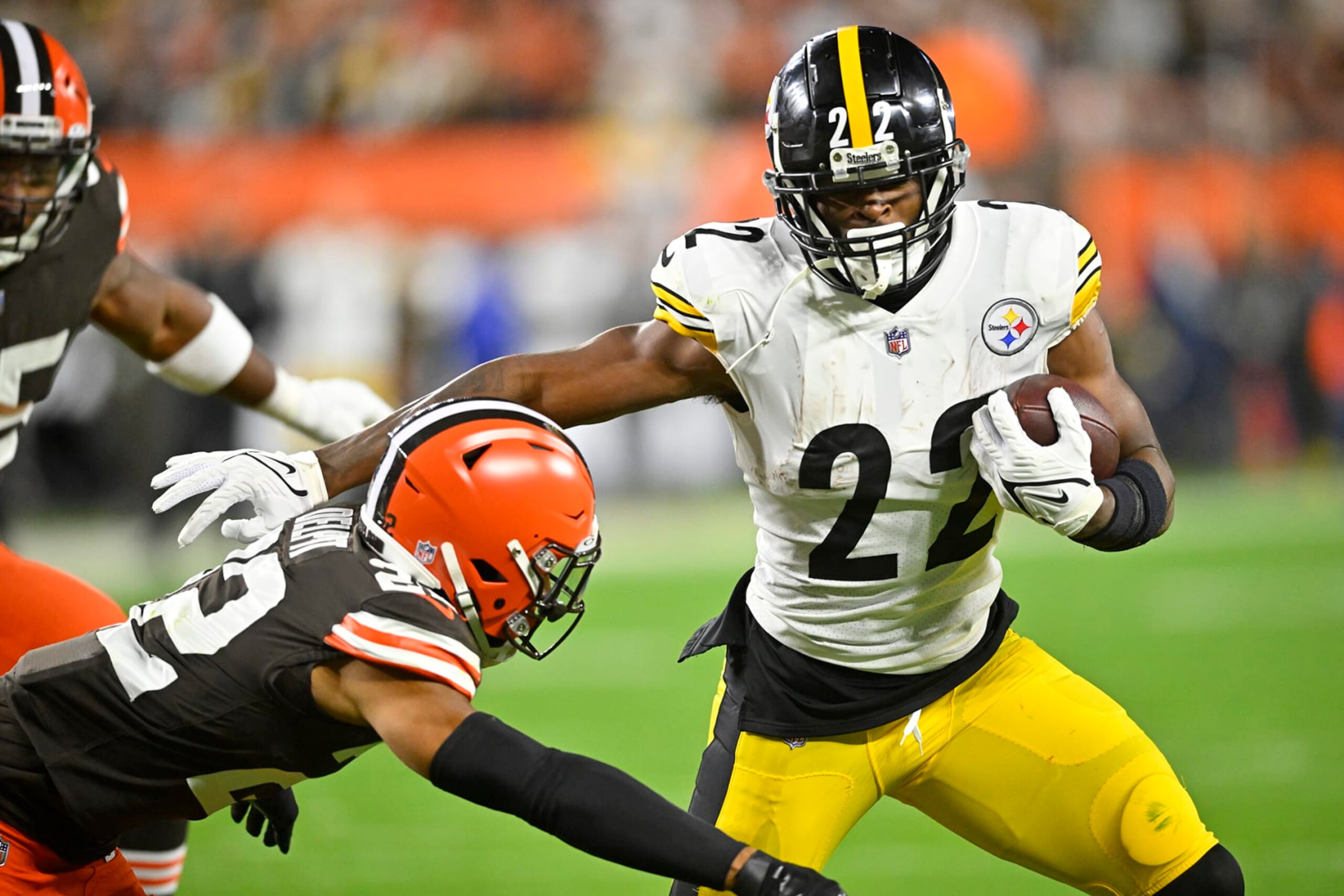 Pittsburgh Steelers running back Najee Harris (22) gets around Cleveland Browns safety Grant Delpit (22) during the first half of an NFL football game in Cleveland, Thursday, Sept. 22, 2022. (AP Photo/David Richard)