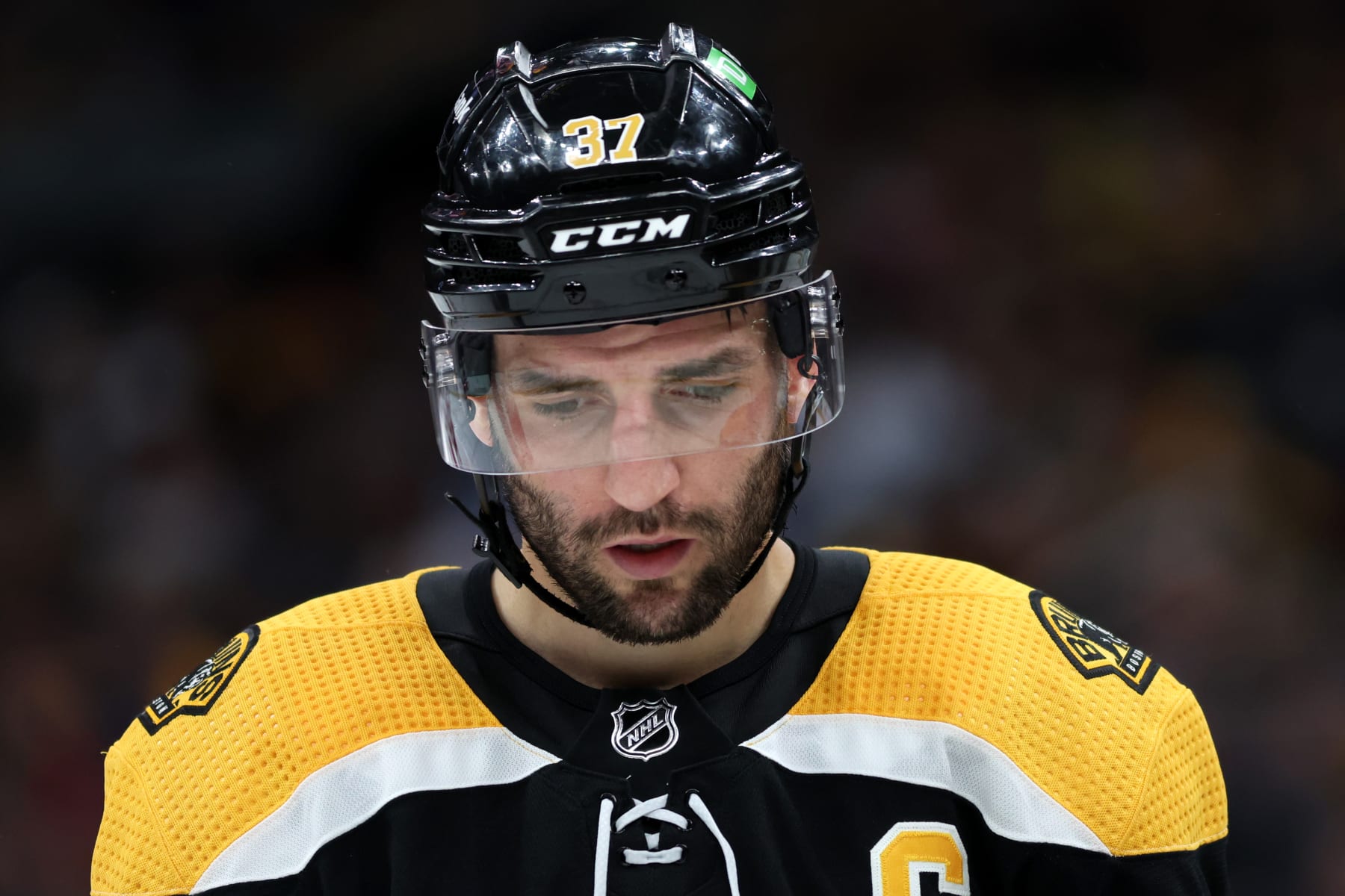 BOSTON, MASSACHUSETTS - MAY 06: Patrice Bergeron #37 of the Boston Bruins looks on during the second period of Game Three of the First Round of the 2022 Stanley Cup Playoffs against the Carolina Hurricanes at TD Garden on May 06, 2022 in Boston, Massachusetts. (Photo by Maddie Meyer/Getty Images)