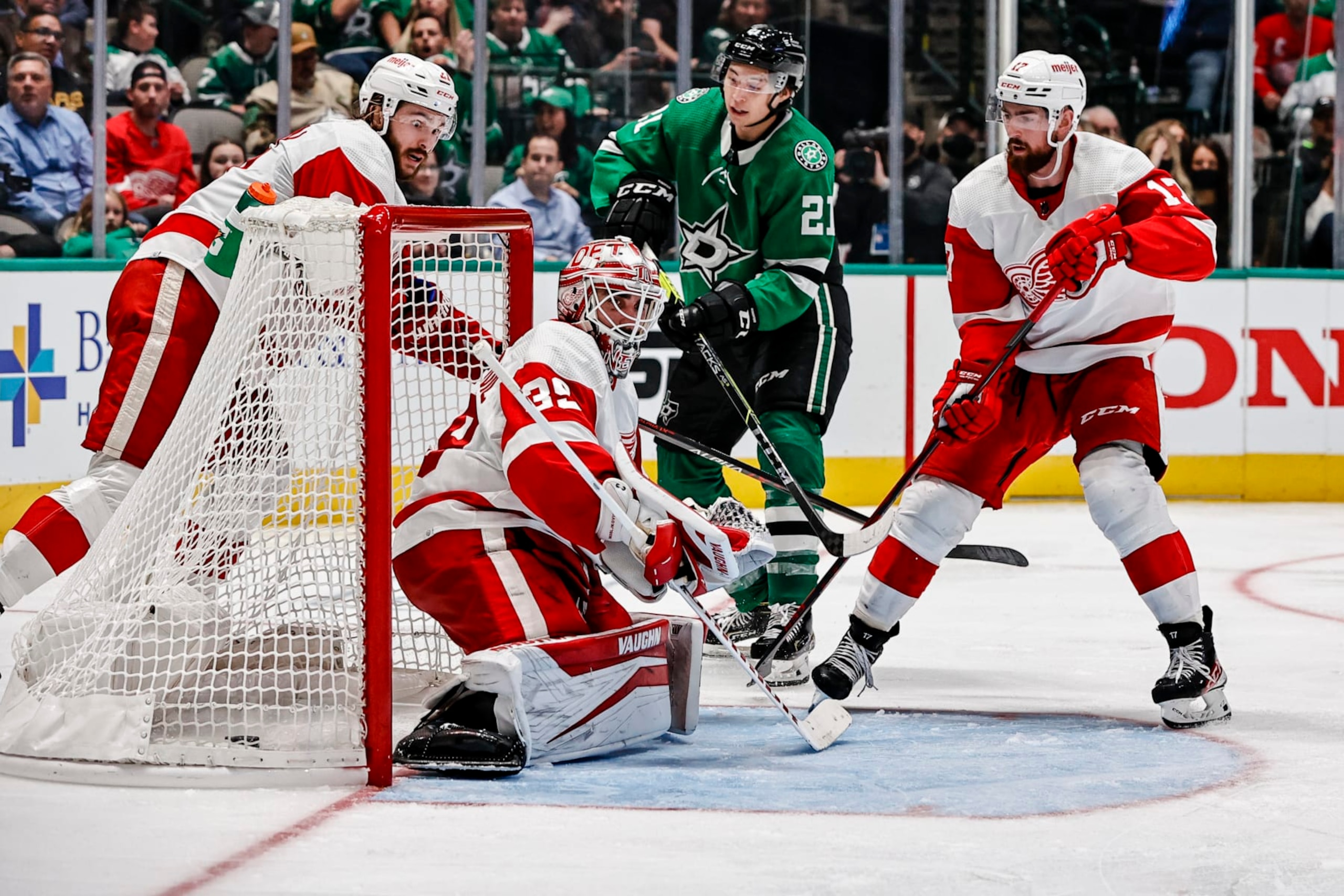 DALLAS, TX - NOVEMBER 16: Dallas Stars left wing Jason Robertson (21) sweeps around the net for a goal past Detroit Red Wings goaltender Alex Nedeljkovic (39) during the game between the Dallas Stars and the Detroit Red Wings on November 16, 2021 at the American Airlines Center in Dallas, Texas. (Photo by Matthew Pearce/Icon Sportswire via Getty Images)