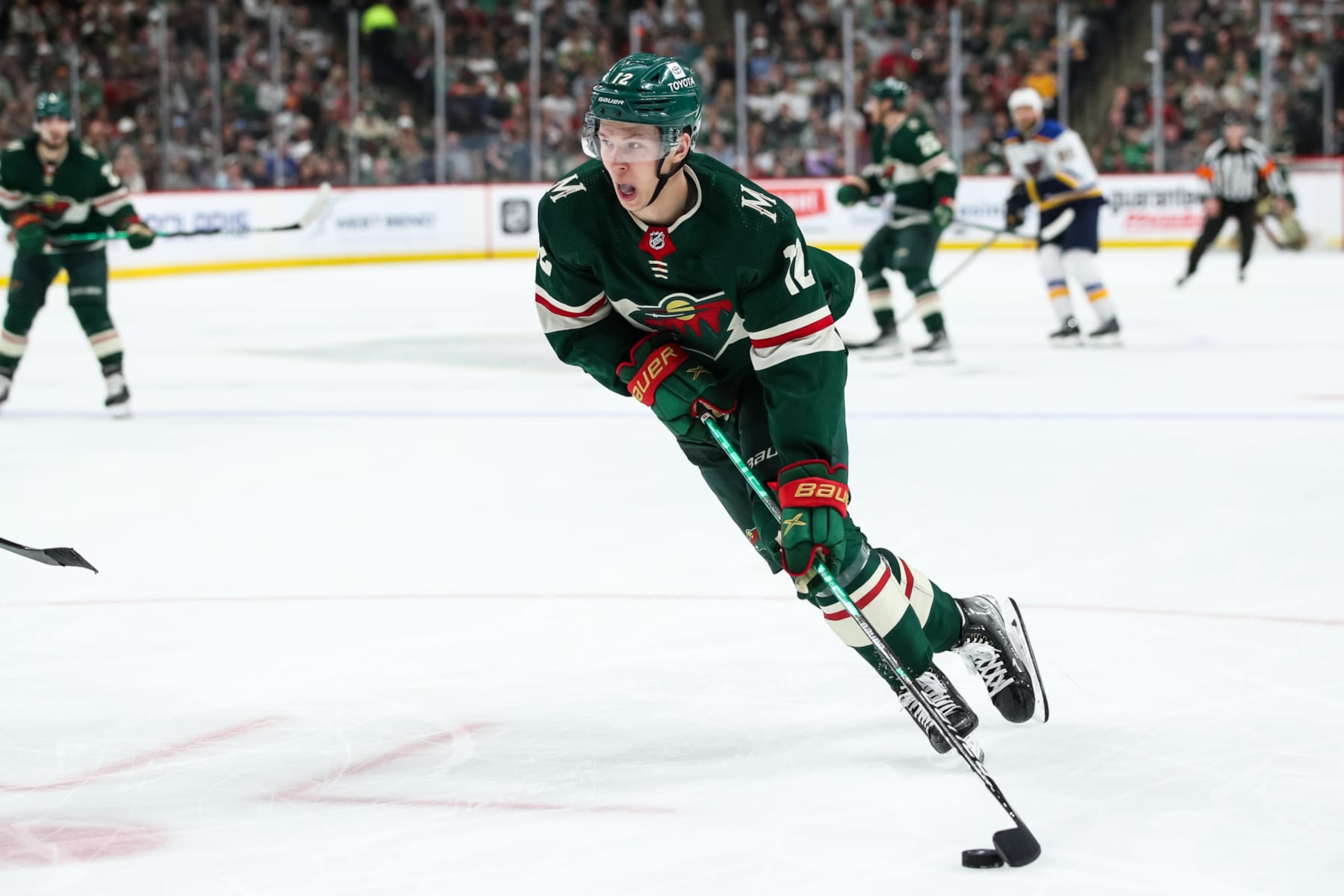 ST PAUL, MN - MAY 10: Matt Boldy #12 of the Minnesota Wild skates with the puck against the St. Louis Blues in the second period in Game Five of the First Round of the 2022 Stanley Cup Playoffs at Xcel Energy Center on May 10, 2022 in St Paul, Minnesota. The Blues defeated the Wild 5-2 to take a 3-2 series lead. (Photo by David Berding/Getty Images)