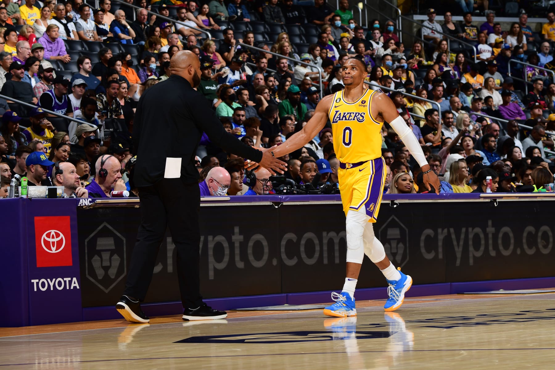 LOS ANGELES, CA - OCTOBER 3: Russell Westbrook #0 high fives Head Coach Darvin Ham of the Los Angeles Lakers during a preseason game against the Sacramento Kings on October 3, 2022 at Crypto.com Arena in Los Angeles, California. NOTE TO USER: User expressly acknowledges and agrees that, by downloading and/or using this Photograph, user is consenting to the terms and conditions of the Getty Images License Agreement. Mandatory Copyright Notice: Copyright 2022 NBAE (Photo by Adam Pantozzi/NBAE via Getty Images)