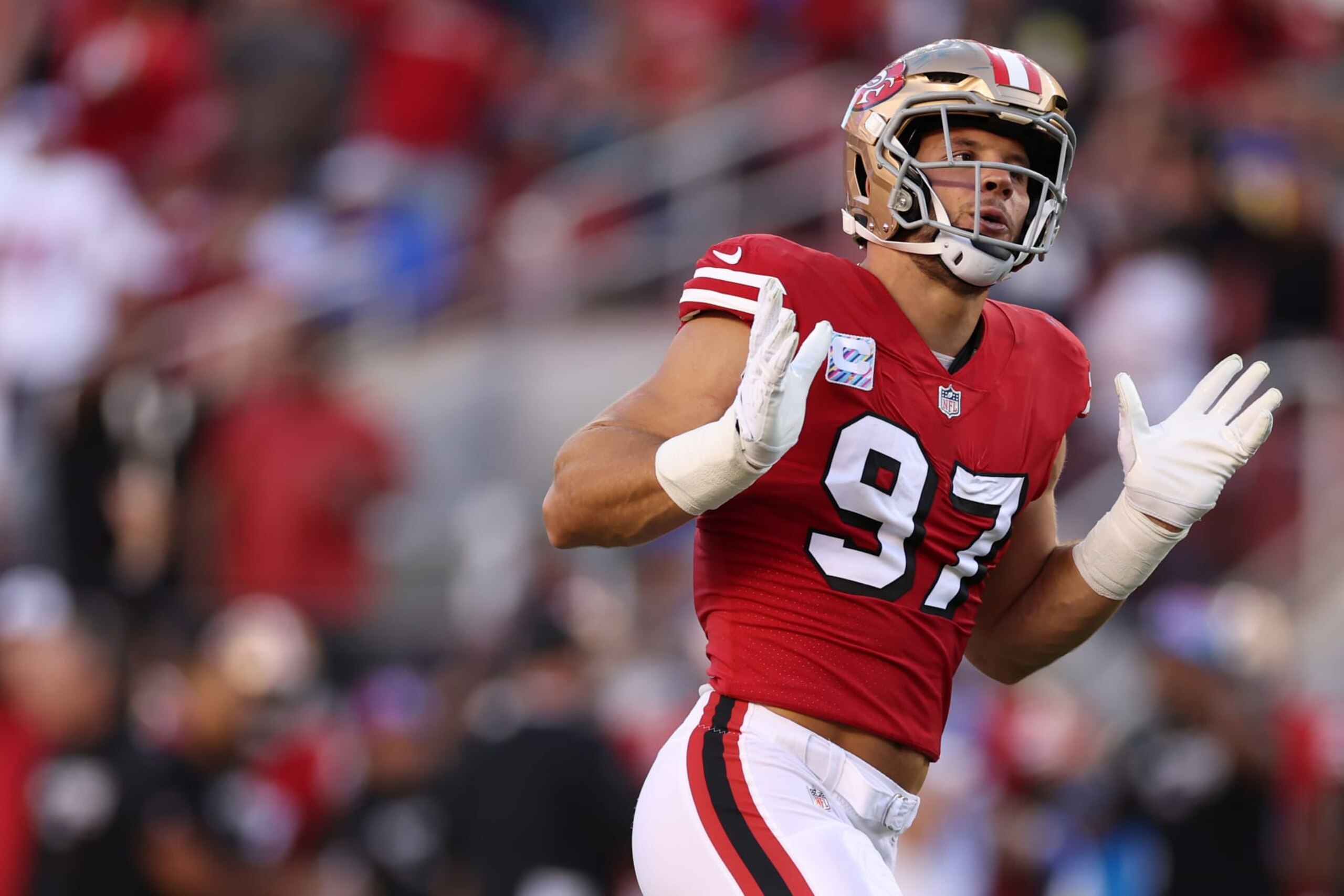 SANTA CLARA, CALIFORNIA - OCTOBER 03: Defensive end Nick Bosa #97 of the San Francisco 49ers celebrates his sack on quarterback Matthew Stafford #9 of the Los Angeles Rams (not pictured) during the first quarter at Levi's Stadium on October 03, 2022 in Santa Clara, California. (Photo by Ezra Shaw/Getty Images)