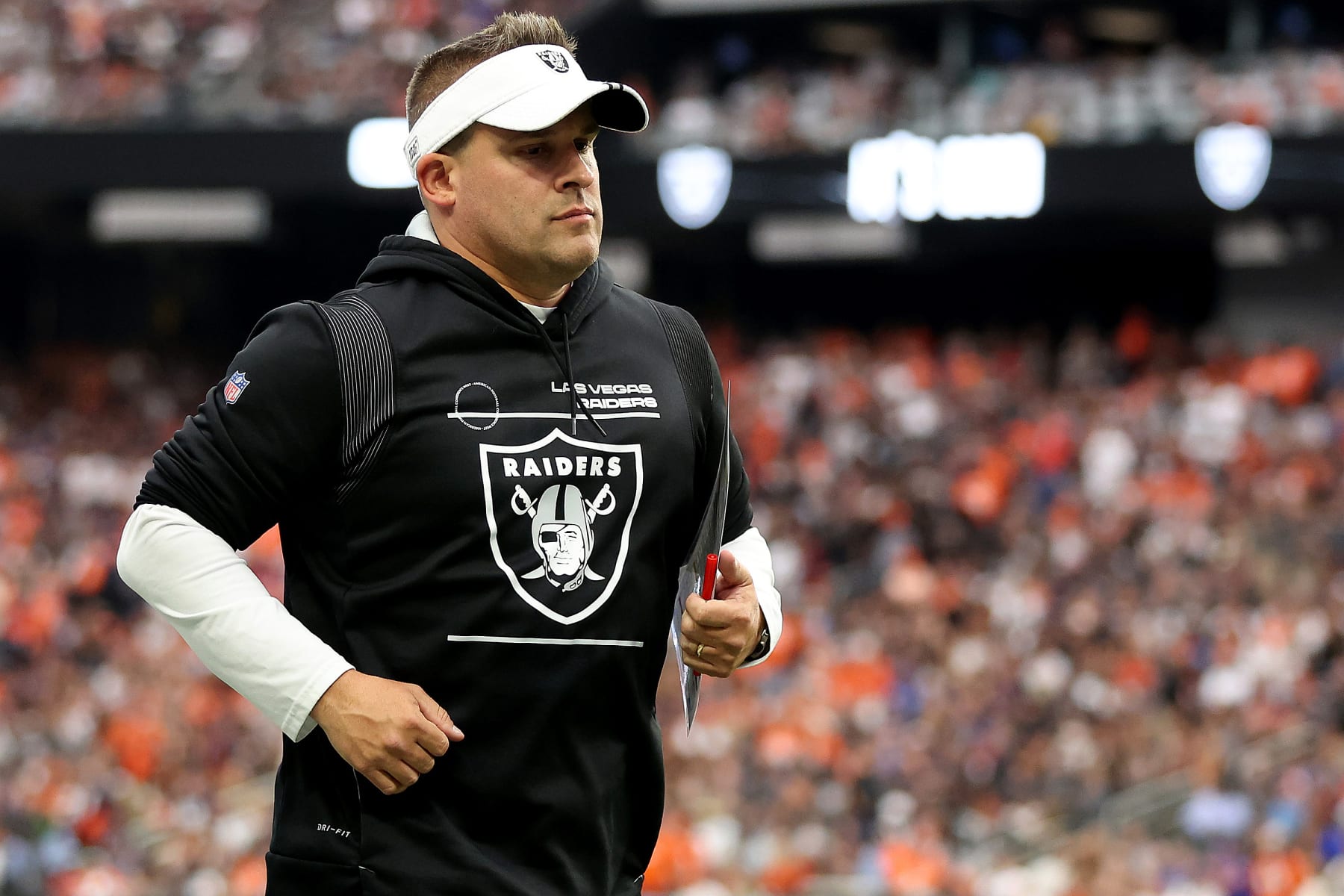 LAS VEGAS, NEVADA - OCTOBER 02: Head coach Josh McDaniels of the Las Vegas Raiders jogs across the field at halftime against the Denver Broncos at Allegiant Stadium on October 02, 2022 in Las Vegas, Nevada. (Photo by Christian Petersen/Getty Images)