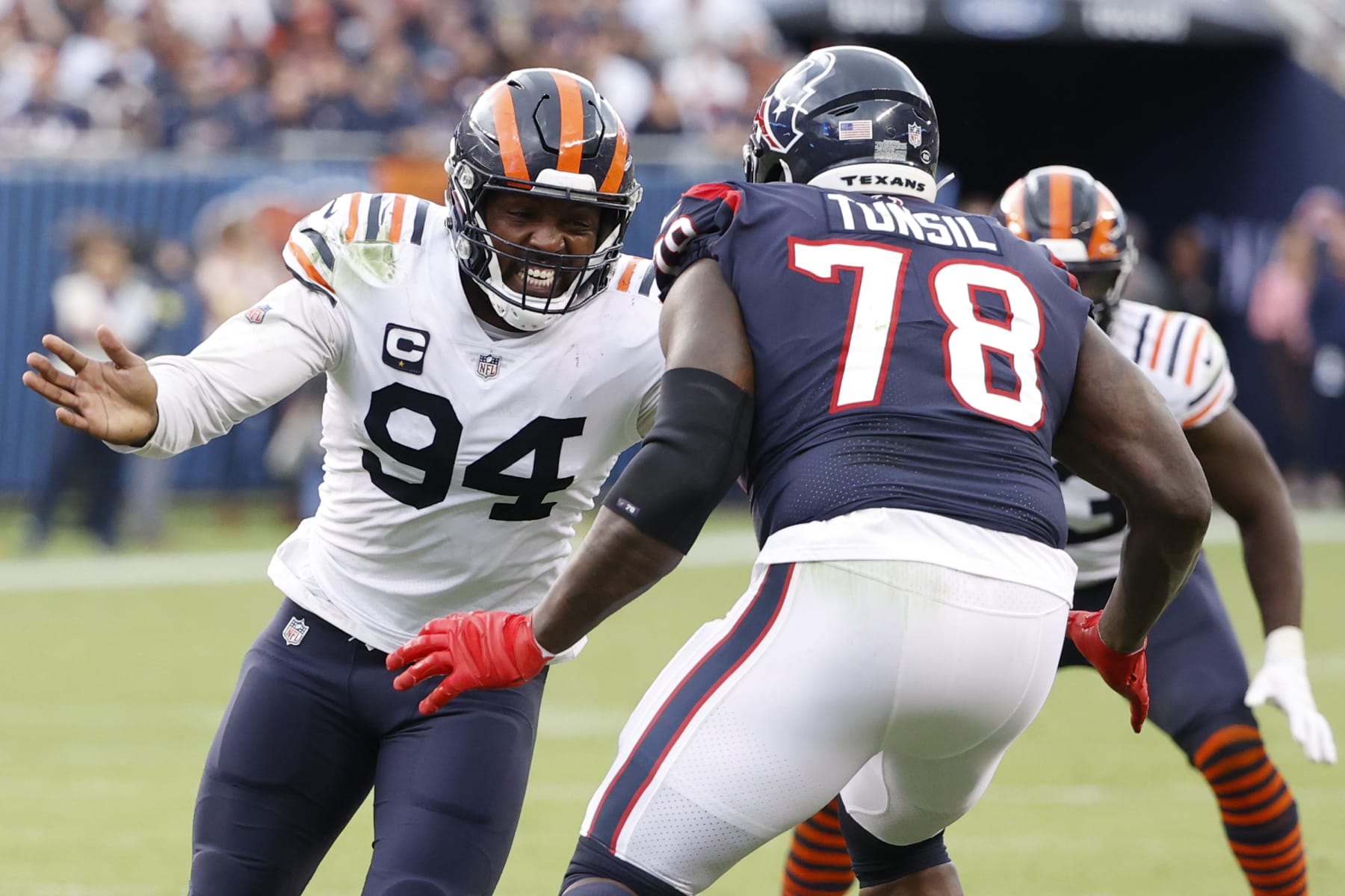 Chicago Bears linebacker Robert Quinn (94) defends against Houston Texans offensive tackle Laremy Tunsil (78) during the second half of an NFL football game, Sunday, Sept. 25, 2022, in Chicago. (AP Photo/Kamil Krzaczynski)