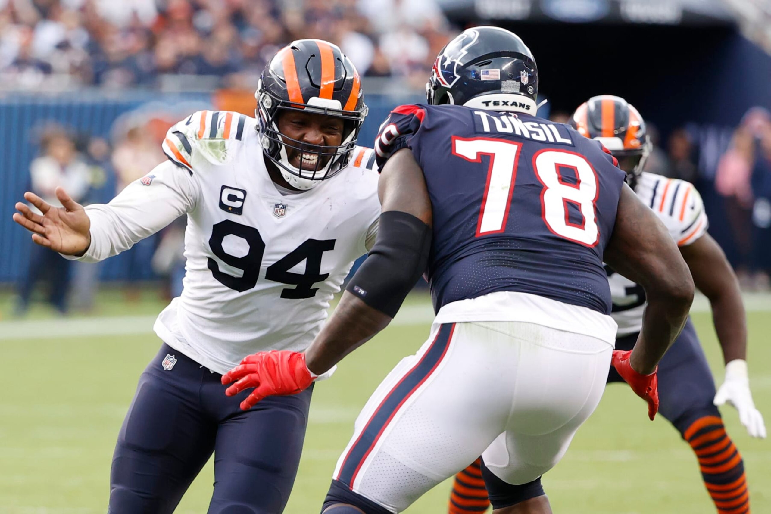 Chicago Bears linebacker Robert Quinn (94) defends against Houston Texans offensive tackle Laremy Tunsil (78) during the second half of an NFL football game, Sunday, Sept. 25, 2022, in Chicago. (AP Photo/Kamil Krzaczynski)
