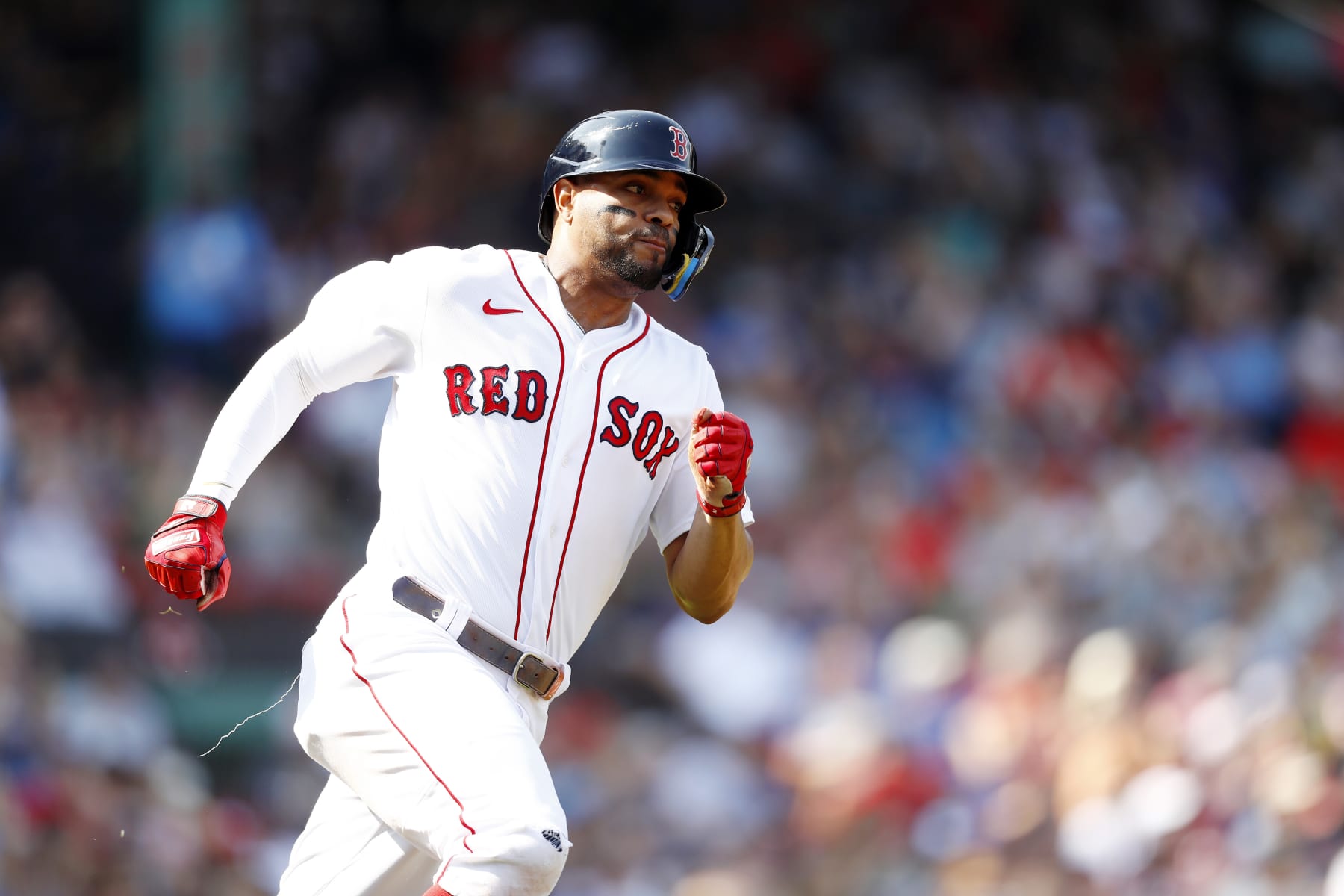 BOSTON, MASSACHUSETTS - SEPTEMBER 18: Xander Bogaerts #2 of the Boston Red Sox rounds first base after hitting an RBI double in the bottom of the first inning of the game against the Kansas City Royals at Fenway Park on September 18, 2022 in Boston, Massachusetts. (Photo by Omar Rawlings/Getty Images)