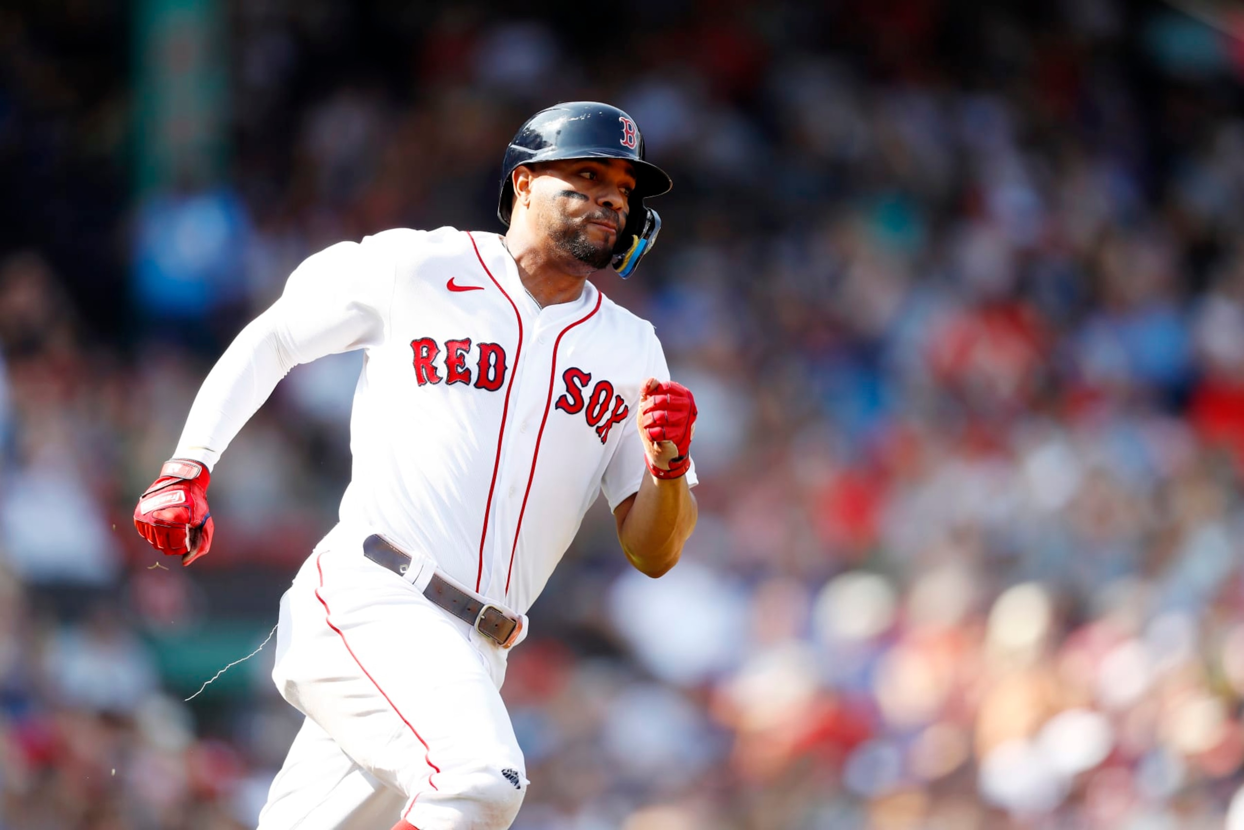 BOSTON, MASSACHUSETTS - SEPTEMBER 18: Xander Bogaerts #2 of the Boston Red Sox rounds first base after hitting an RBI double in the bottom of the first inning of the game against the Kansas City Royals at Fenway Park on September 18, 2022 in Boston, Massachusetts. (Photo by Omar Rawlings/Getty Images)